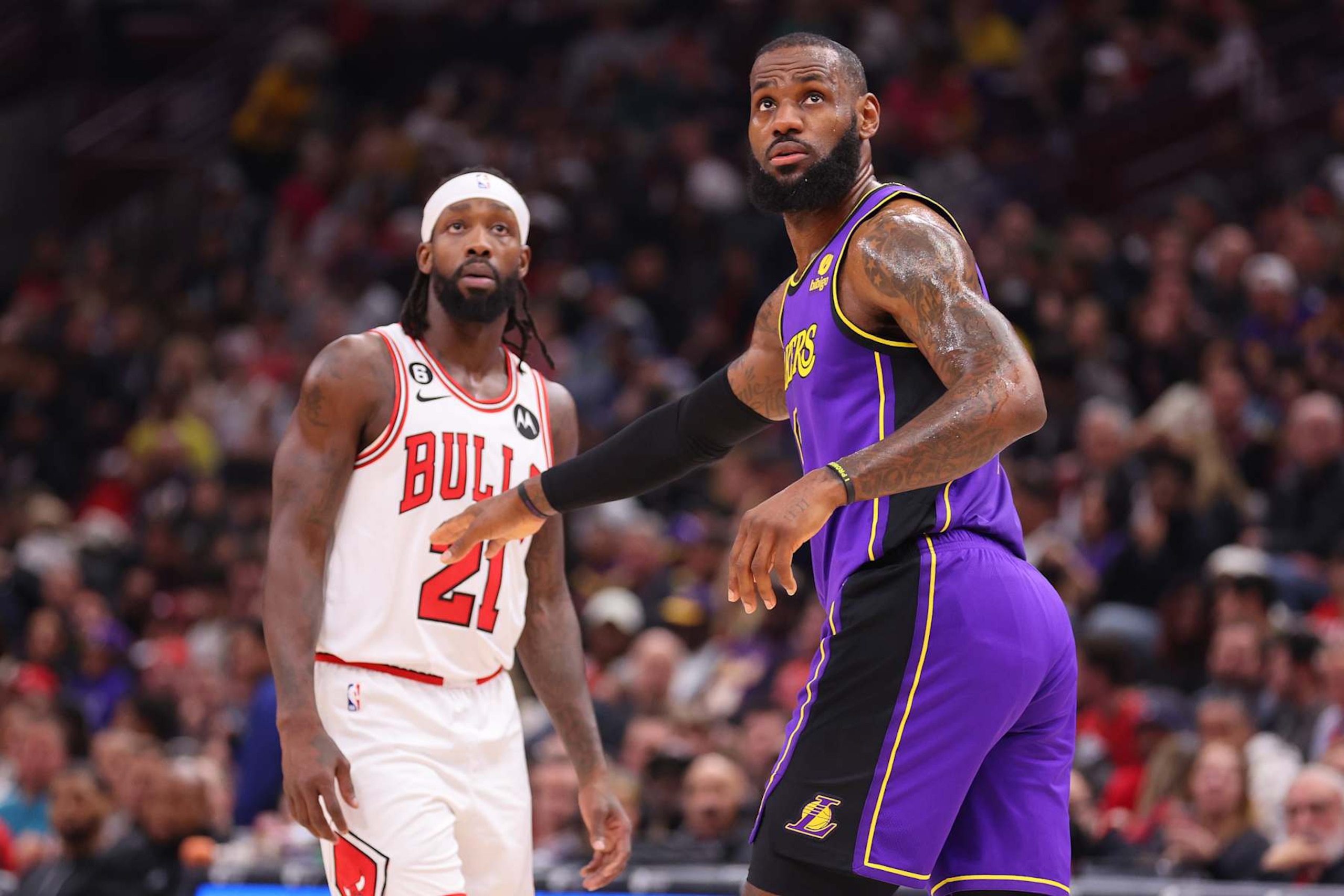 CHICAGO, ILLINOIS - MARCH 29: Patrick Beverley #21 of the Chicago Bulls and LeBron James #6 of the Los Angeles Lakers look on during the first half at United Center on March 29, 2023 in Chicago, Illinois. NOTE TO USER: User expressly acknowledges and agrees that, by downloading and or using this photograph, User is consenting to the terms and conditions of the Getty Images License Agreement. (Photo by Michael Reaves/Getty Images)