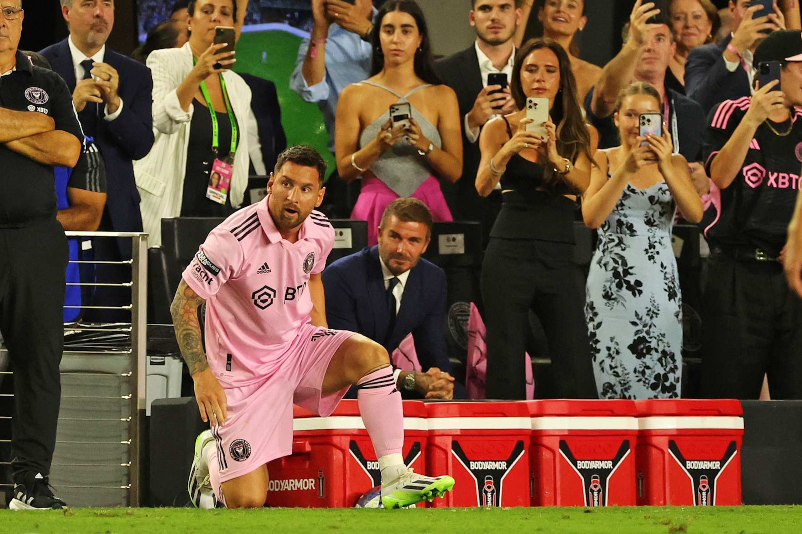 FORT LAUDERDALE, FLORIDA - JULY 21: Lionel Messi #10 of Inter Miami CF and co-owner David Beckham look on as fans take photos during the second half of the Leagues Cup 2023 match between Cruz Azul and Inter Miami CF at DRV PNK Stadium on July 21, 2023 in Fort Lauderdale, Florida. (Photo by Stacy Revere/Getty Images)