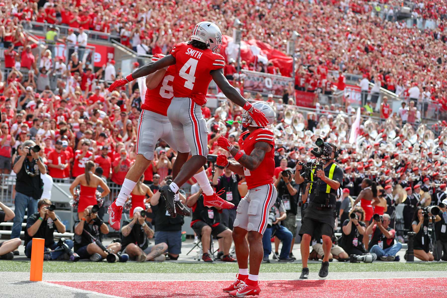 COLUMBUS, OH - AUGUST 31: Ohio State Buckeyes wide receiver Jeremiah Smith (4) reacts after scoring a touchdown during the game against the Akron Zips and the Ohio State Buckeyes on August 31, 2024, at Ohio Stadium in Columbus, OH. (Photo by Ian Johnson/Icon Sportswire via Getty Images)