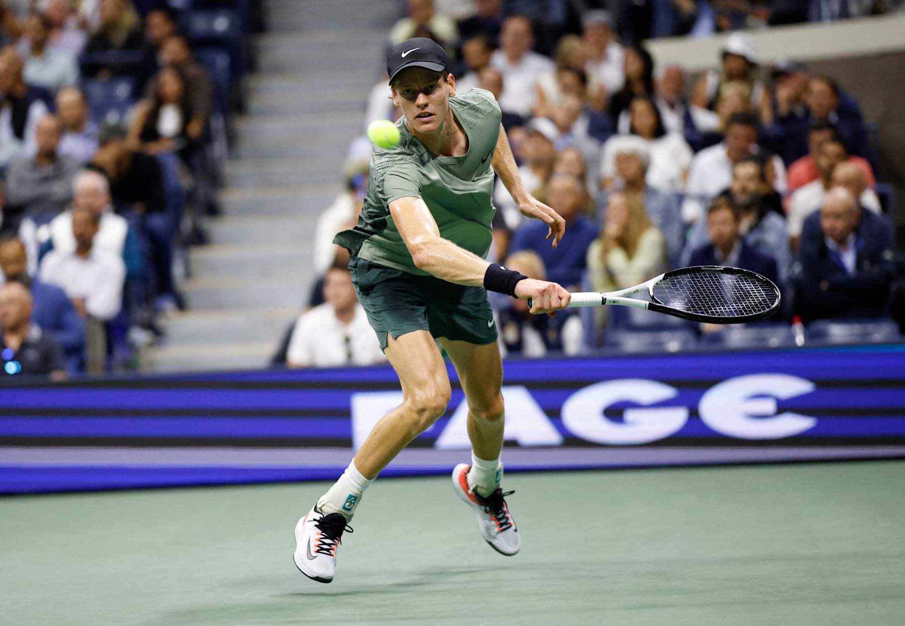 Italy's Jannik Sinner returns the ball to Russia's Daniil Medvedev during their men's quarterfinals match on day ten of the US Open tennis tournament at the USTA Billie Jean King National Tennis Center in New York City, on September 4, 2024. (Photo by KENA BETANCUR / AFP) (Photo by KENA BETANCUR/AFP via Getty Images)