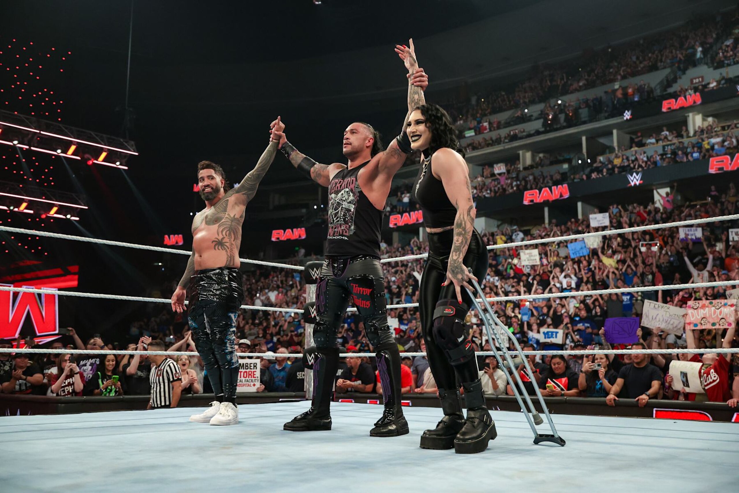 DENVER, COLORADO - SEPTEMBER 2: Jey Uso and Damian Priest celebate their victory alongside Rhea Ripley during Monday Night RAW at Ball Arena on September 2, 2024 in Denver, Colorado.  (Photo by WWE/Getty Images)