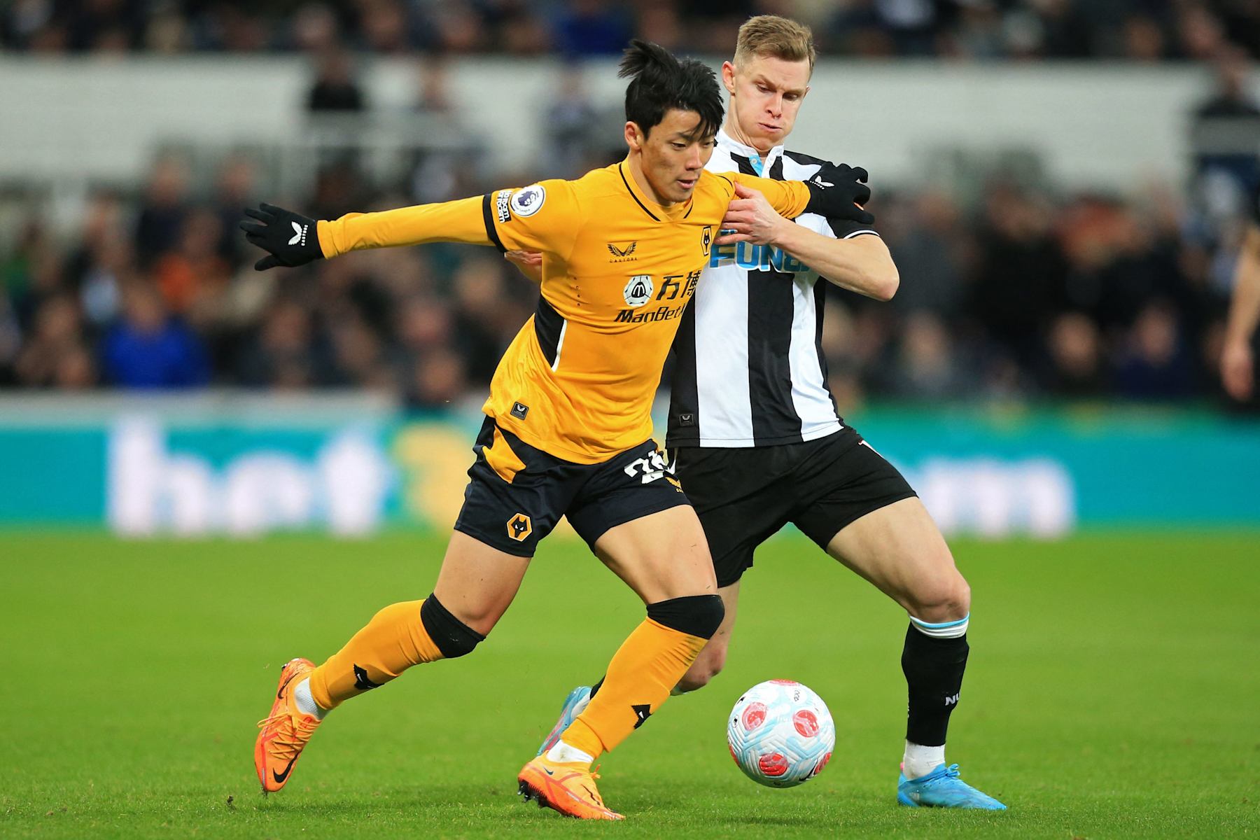 Hwang Hee Chan and Emil Krafth.