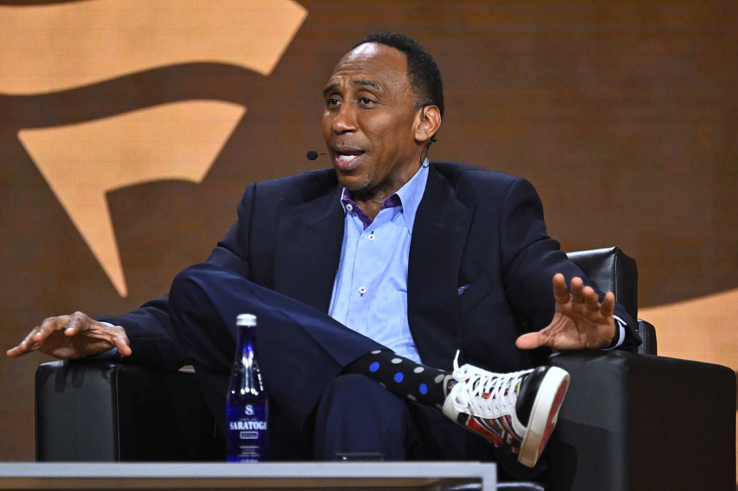 NEW YORK, NEW YORK - AUGUST 18: Stephen A. Smith speaks onstage during the Fanatics Fest NYC 2024 at Jacob Javits Center on August 18, 2024 in New York City.  (Photo by Roy Rochlin/Getty Images for Fanatics)