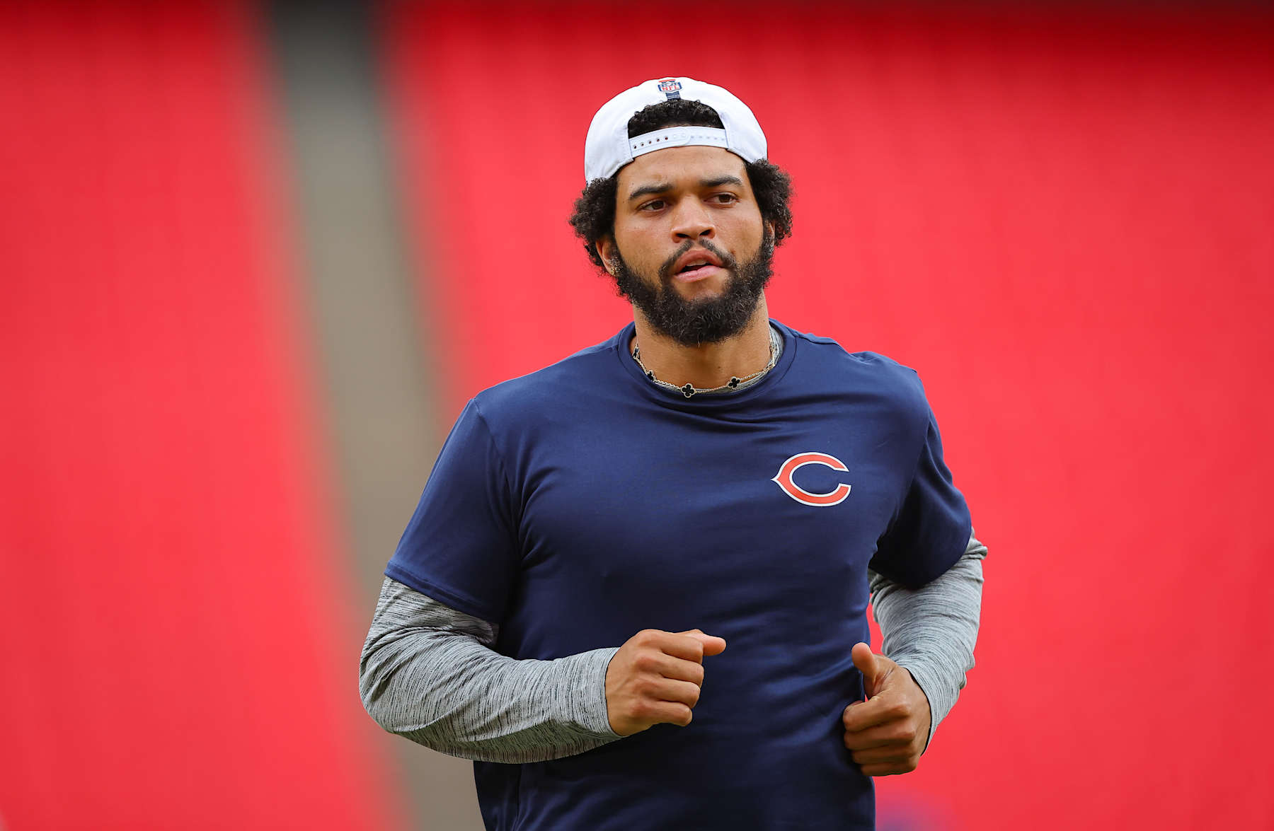 KANSAS CITY, MISSOURI - AUGUST 22: Caleb Williams #18 of the Chicago Bears jogs during warmups prior to a preseason game against the Kansas City Chiefs at GEHA Field at Arrowhead Stadium on August 22, 2024 in Kansas City, Missouri.  (Photo by David Eulitt/Getty Images)