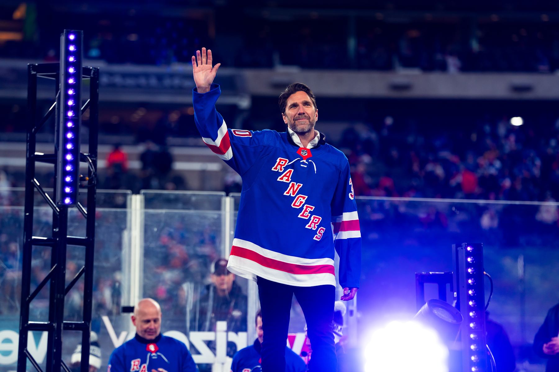EAST RUTHERFORD, NEW JERSEY - FEBRUARY 18:  Former New York Rangers player Henrik Lundqvist salutes the crowd during the second intermission of the game at MetLife Stadium on February 18, 2024 in East Rutherford, New Jersey. (Photo by Dennis DaSilva/NHLI via Getty Images)