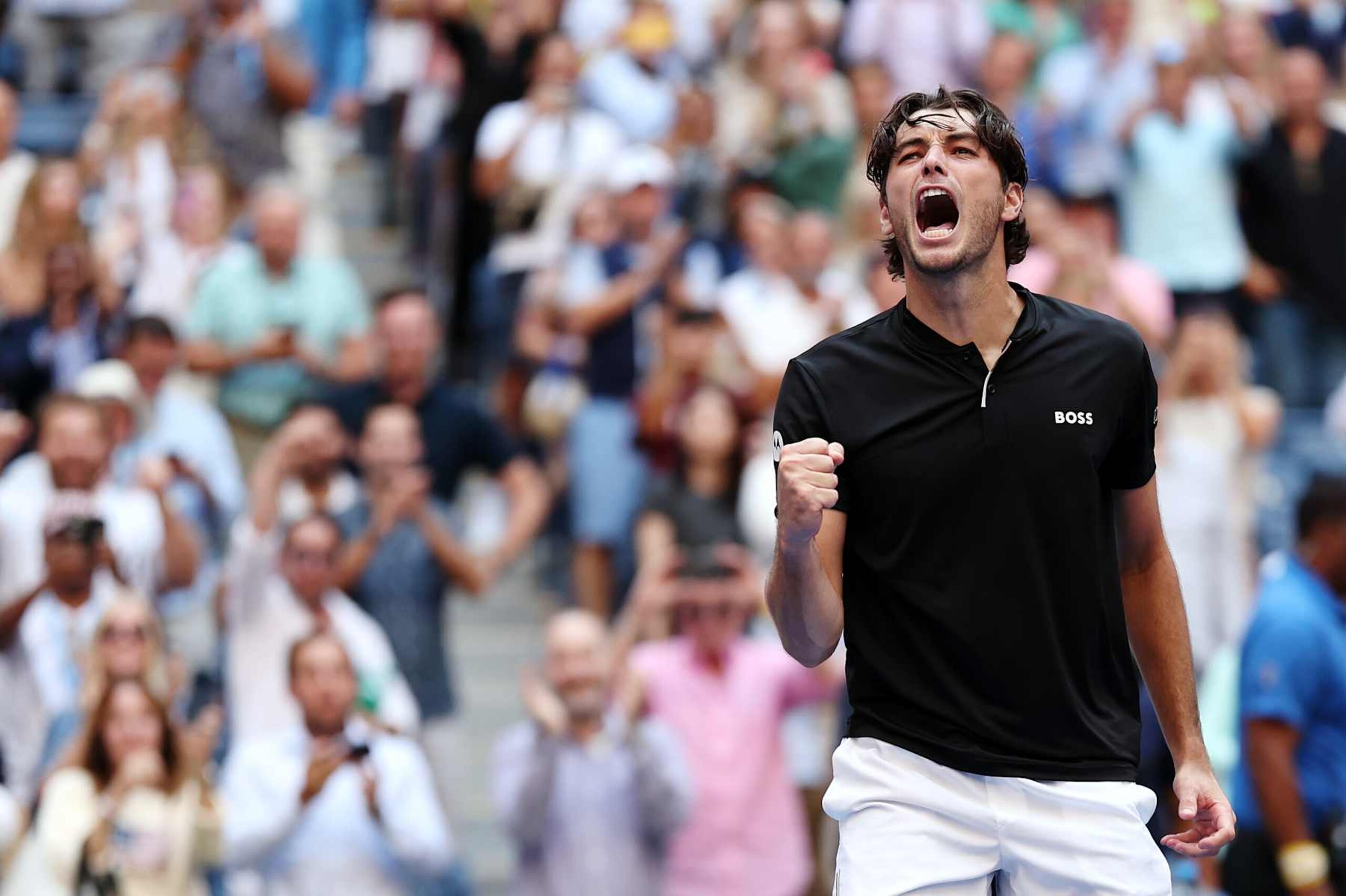 NEW YORK, NEW YORK - SEPTEMBER 03: Taylor Fritz of the United States celebrates after defeating Alexander Zverev of Germany during their Men's Singles Quarterfinal match on Day Nine of the 2024 US Open at USTA Billie Jean King National Tennis Center on September 03, 2024 in the Flushing neighborhood of the Queens borough of New York City. (Photo by Sarah Stier/Getty Images)