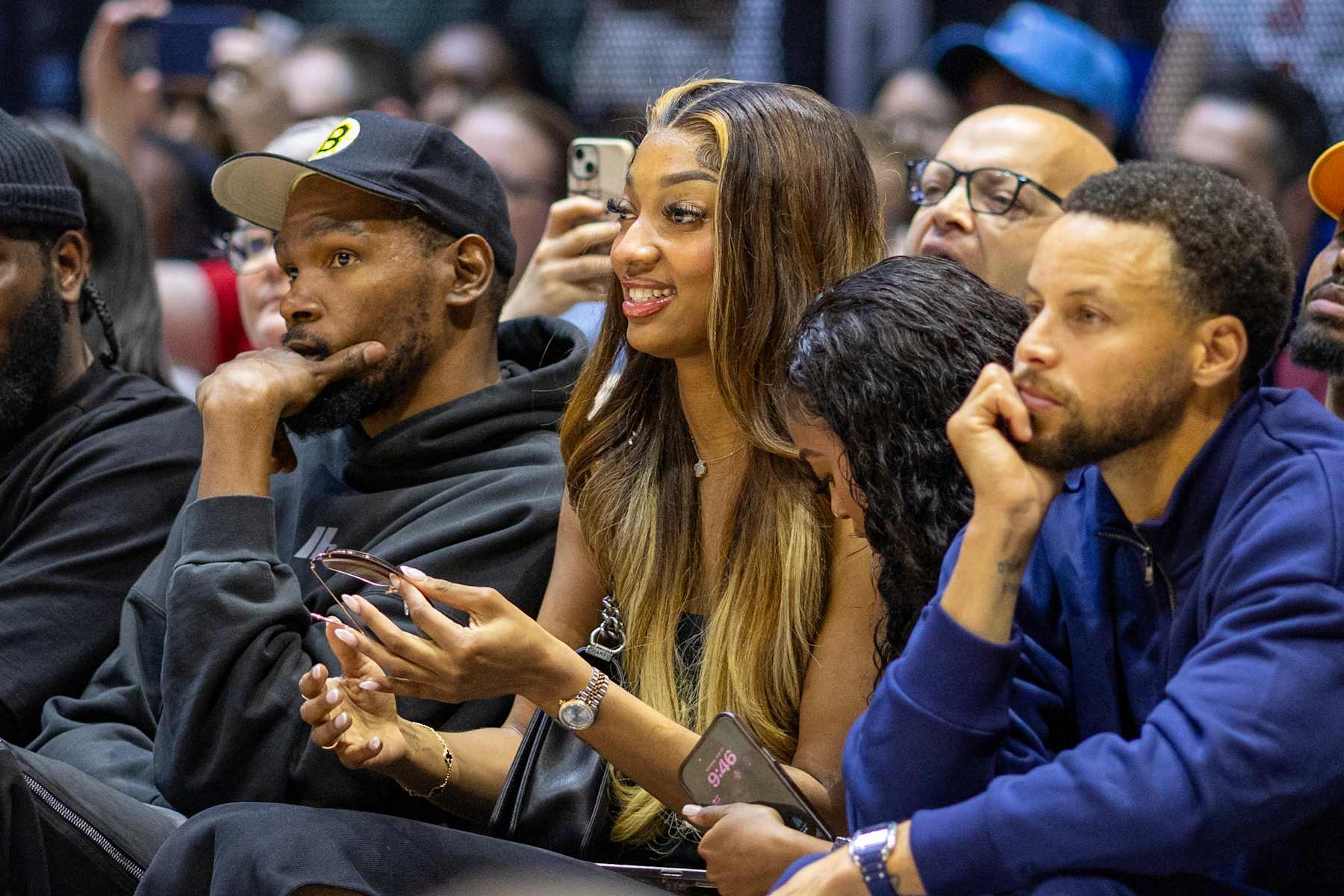 LONDON, ENGLAND: JULY 23:  Kevin Durant, Angel Reese and friend Jasmin Reed, and Stephen Curry watching courtside during the USA V Germany, USA basketball showcase Women's basketball match in preparation for the Paris Olympic Games at The O2 Arena on July 23rd, 2024, in London, England. (Photo by Tim Clayton/Corbis via Getty Images)