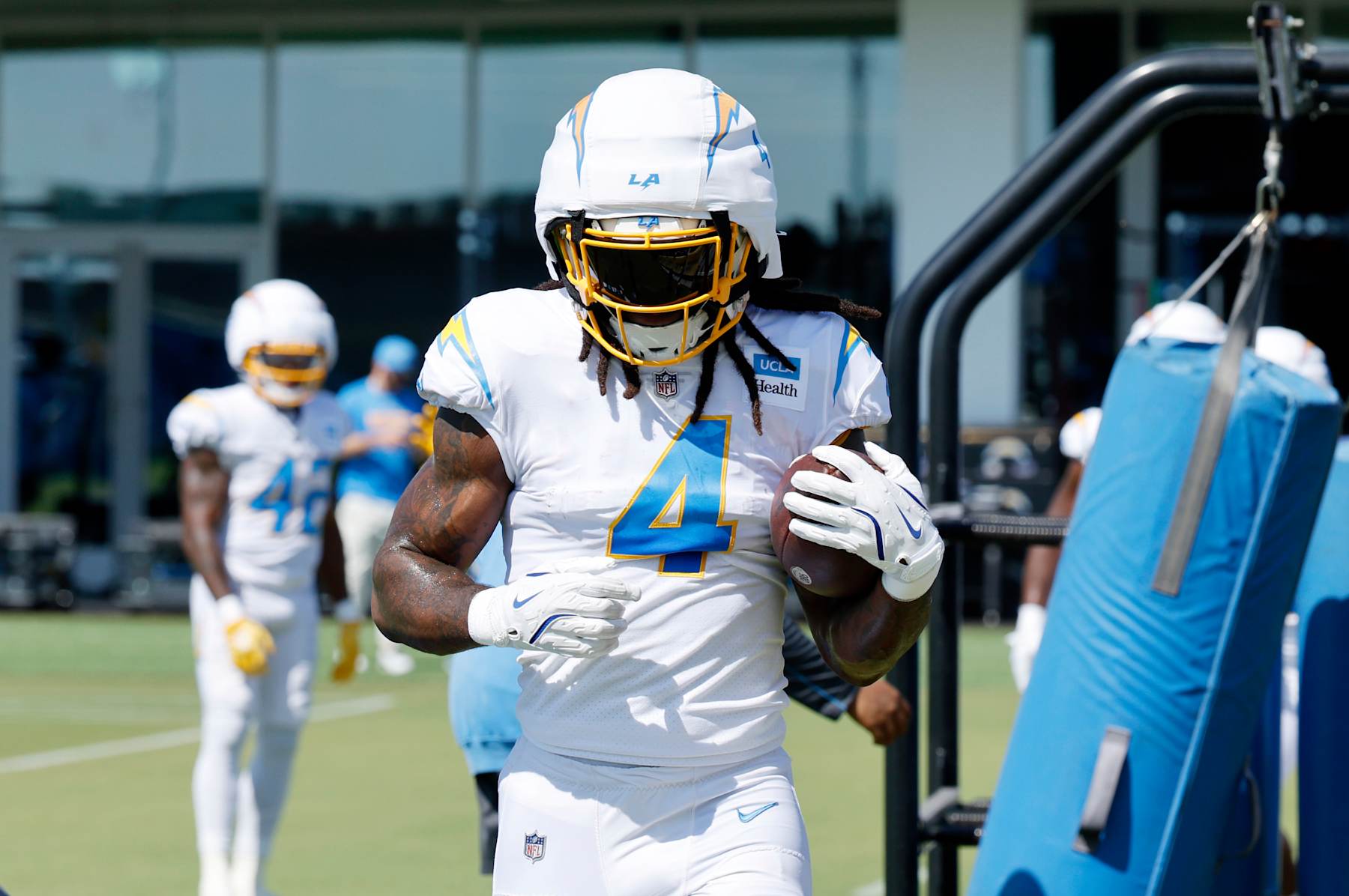 EL SEGUNDO, CALIFORNIA - JULY 29: Running back running back Gus Edwards #4 of the Los Angeles Chargers runs a drill during a training session at The Bolt on July 29, 2024 in El Segundo, California. (Photo by Kevork Djansezian/Getty Images)