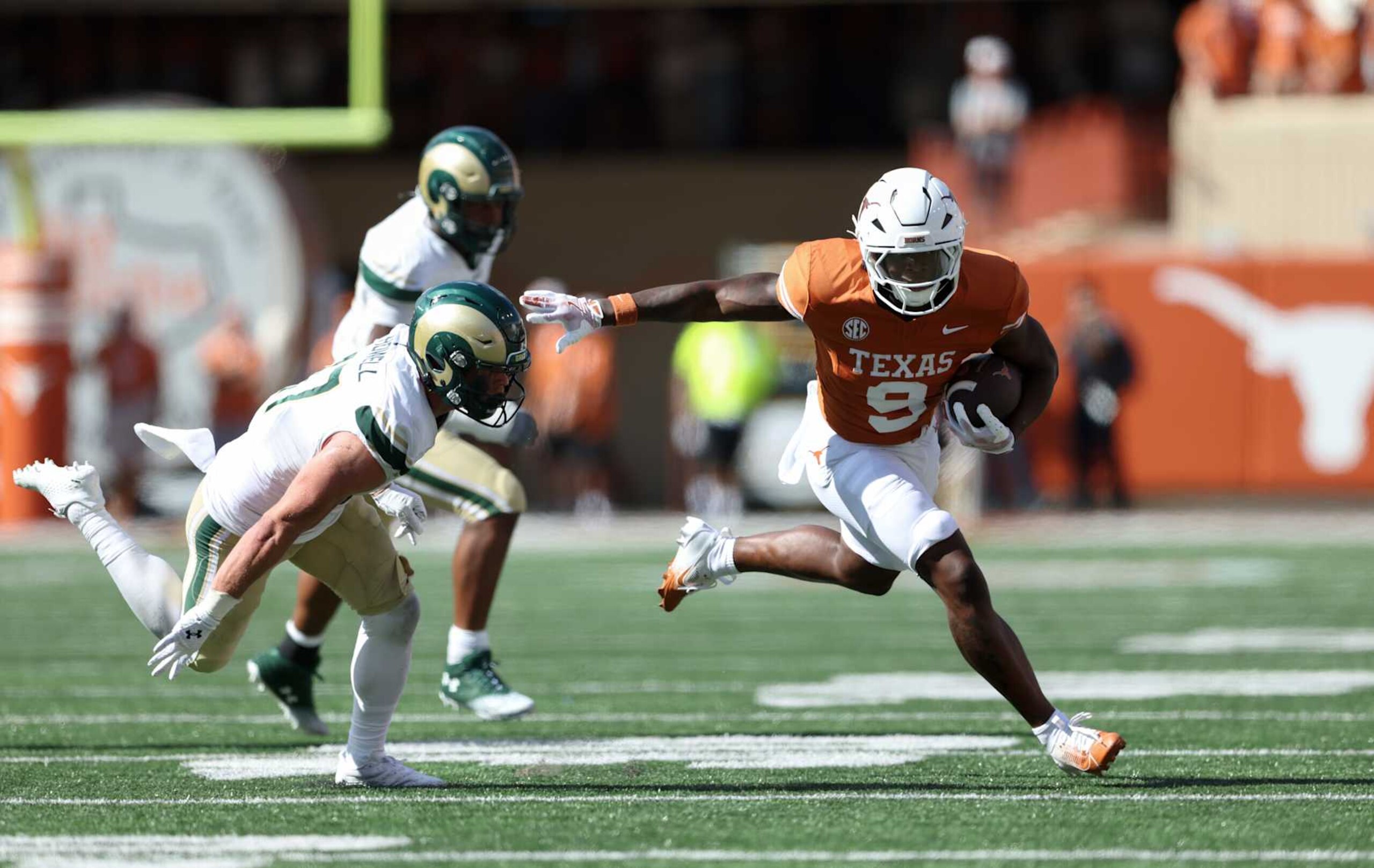 AUSTIN, TEXAS - AUGUST 31: Jerrick Gibson #9 of the Texas Longhorns runs the ball while defended by Jack Howell #17 of the Colorado State Rams in the second half at Darrell K Royal-Texas Memorial Stadium on August 31, 2024 in Austin, Texas. (Photo by Tim Warner/Getty Images)
