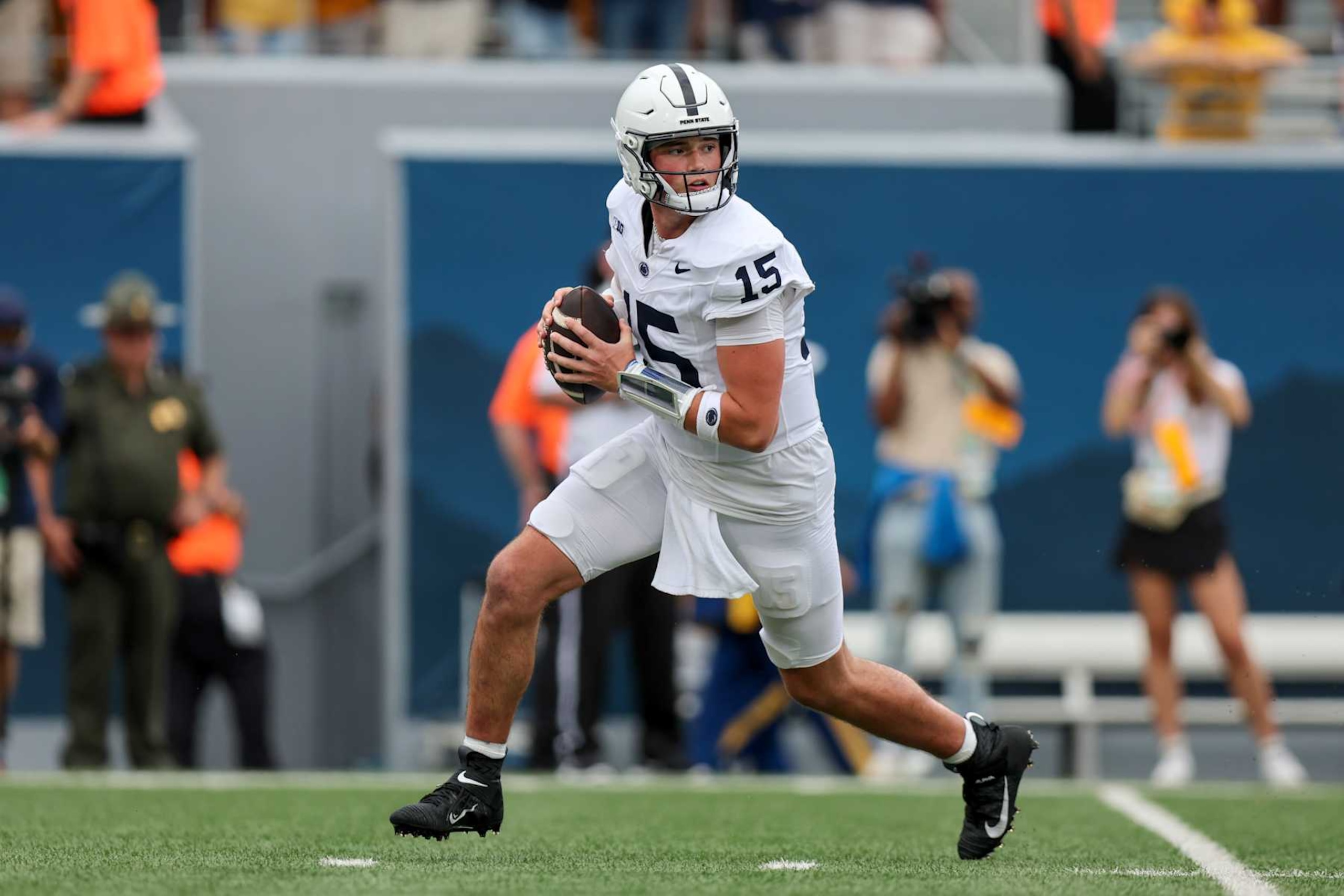 MORGANTOWN, WV - AUGUST 31: Penn State Nittany Lions quarterback Drew Allar (15) rolls out of the pocket during the third quarter of the college football game between the Penn State Nittany Lions and the West Virginia Mountaineers on August 31, 2024, at Mountaineer Field at Milan Puskar Stadium in Morgantown, WV. (Photo by Frank Jansky/Icon Sportswire via Getty Images)