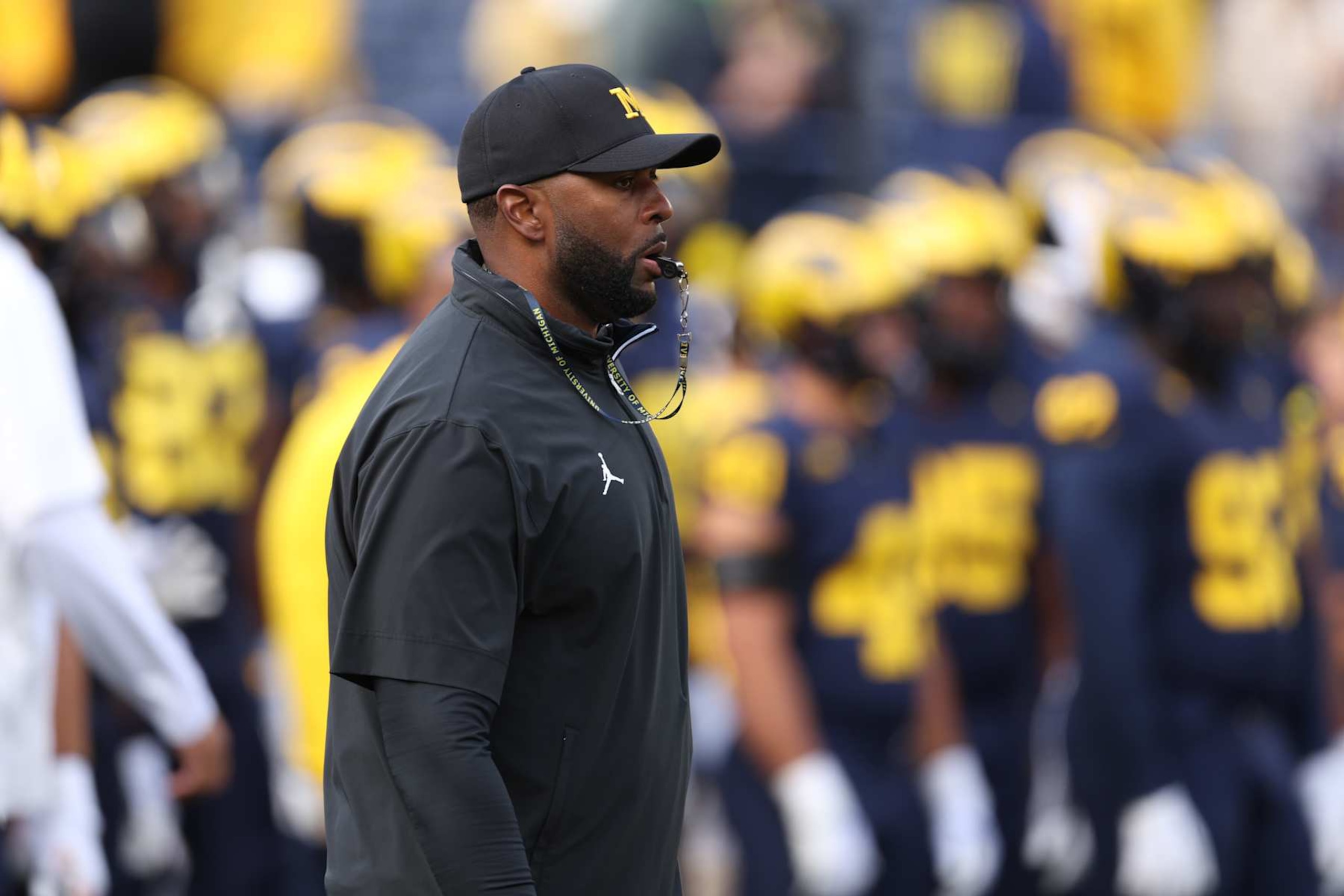 ANN ARBOR, MICHIGAN - SEPTEMBER 07: Head coach Sherrone Moore of the Michigan Wolverines is seen on the field during warmups prior to a game against the Texas Longhorns at Michigan Stadium on September 07, 2024 in Ann Arbor, Michigan. (Photo by Gregory Shamus/Getty Images) ANN ARBOR, MICHIGAN - SEPTEMBER 07: Head coach Sherrone Moore of the Michigan Wolverines is seen on the field during warmups prior to a game against the Texas Longhorns at Michigan Stadium on September 07, 2024 in Ann Arbor, Michigan. (Photo by Gregory Shamus/Getty Images)