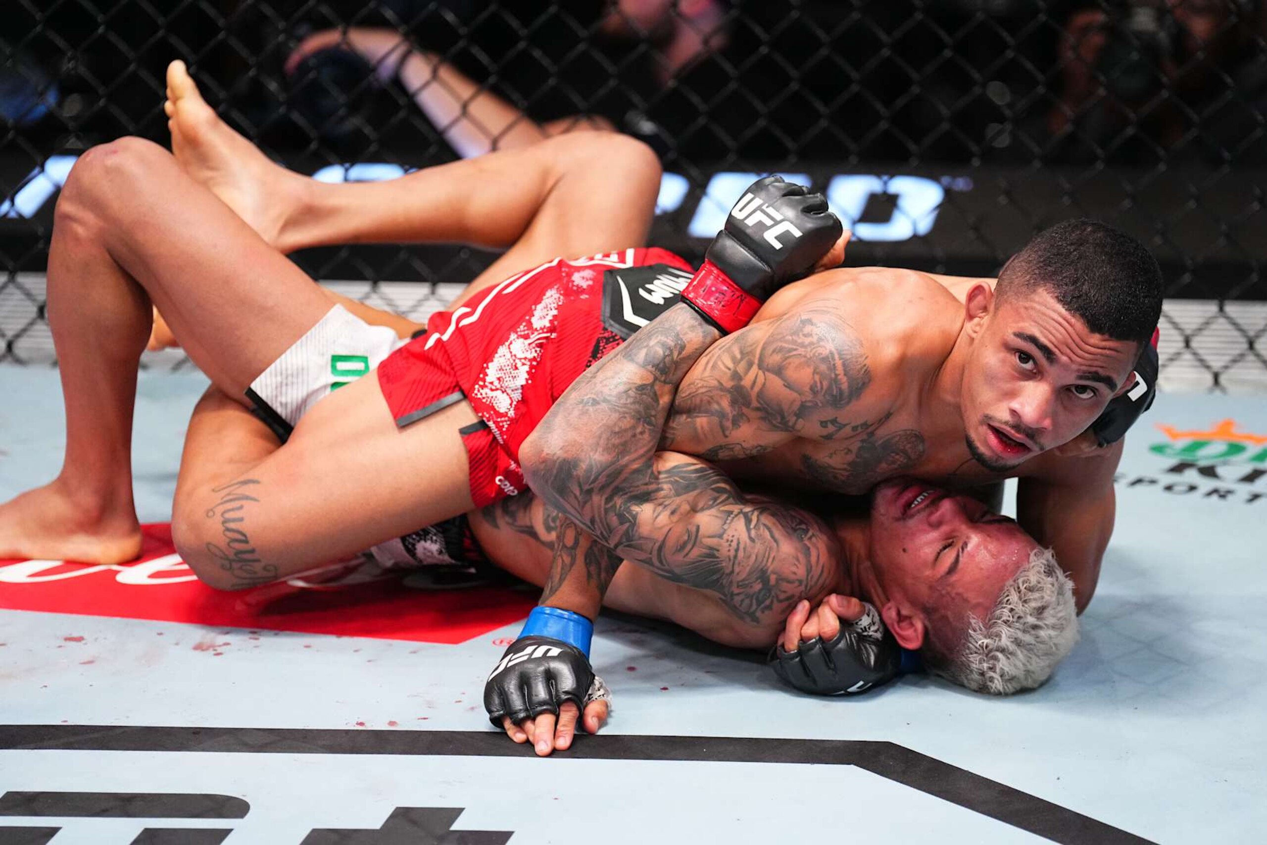 LAS VEGAS, NEVADA - SEPTEMBER 07: (L-R) Andre Lima of Brazil battles Felipe dos Santos of Brazil in a flyweight fight during the UFC Fight Night event at UFC APEX on September 07, 2024 in Las Vegas, Nevada. (Photo by Chris Unger/Zuffa LLC via Getty Images)