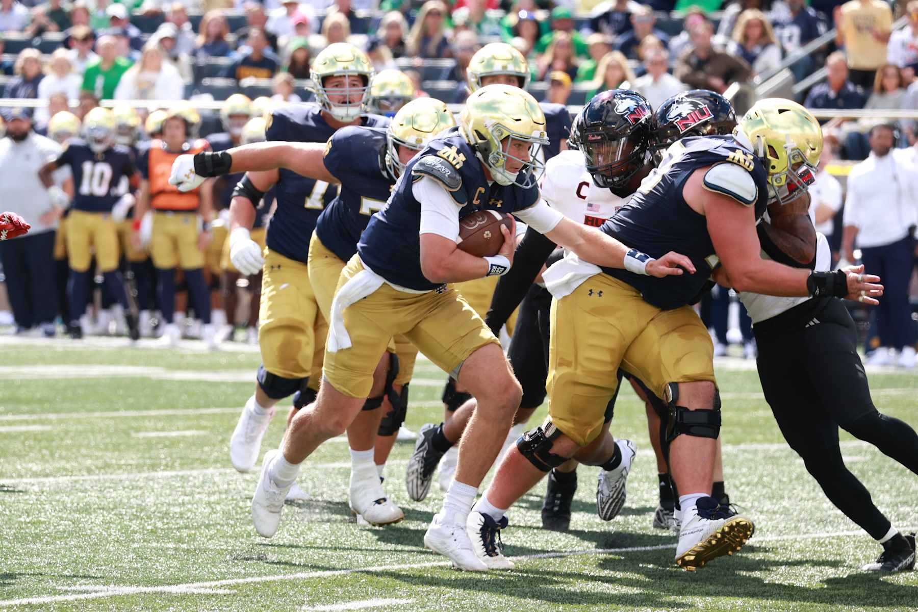 SOUTH BEND, IN - SEPTEMBER 07: Notre Dame Fighting Irish quarterback Riley Leonard (13) runs the ball in for a touchdown against the Northern Illinois Huskies on September 7, 2024, at Notre Dame Stadium in South Bend, Indiana. (Photo by Brian Spurlock/Icon Sportswire via Getty Images)