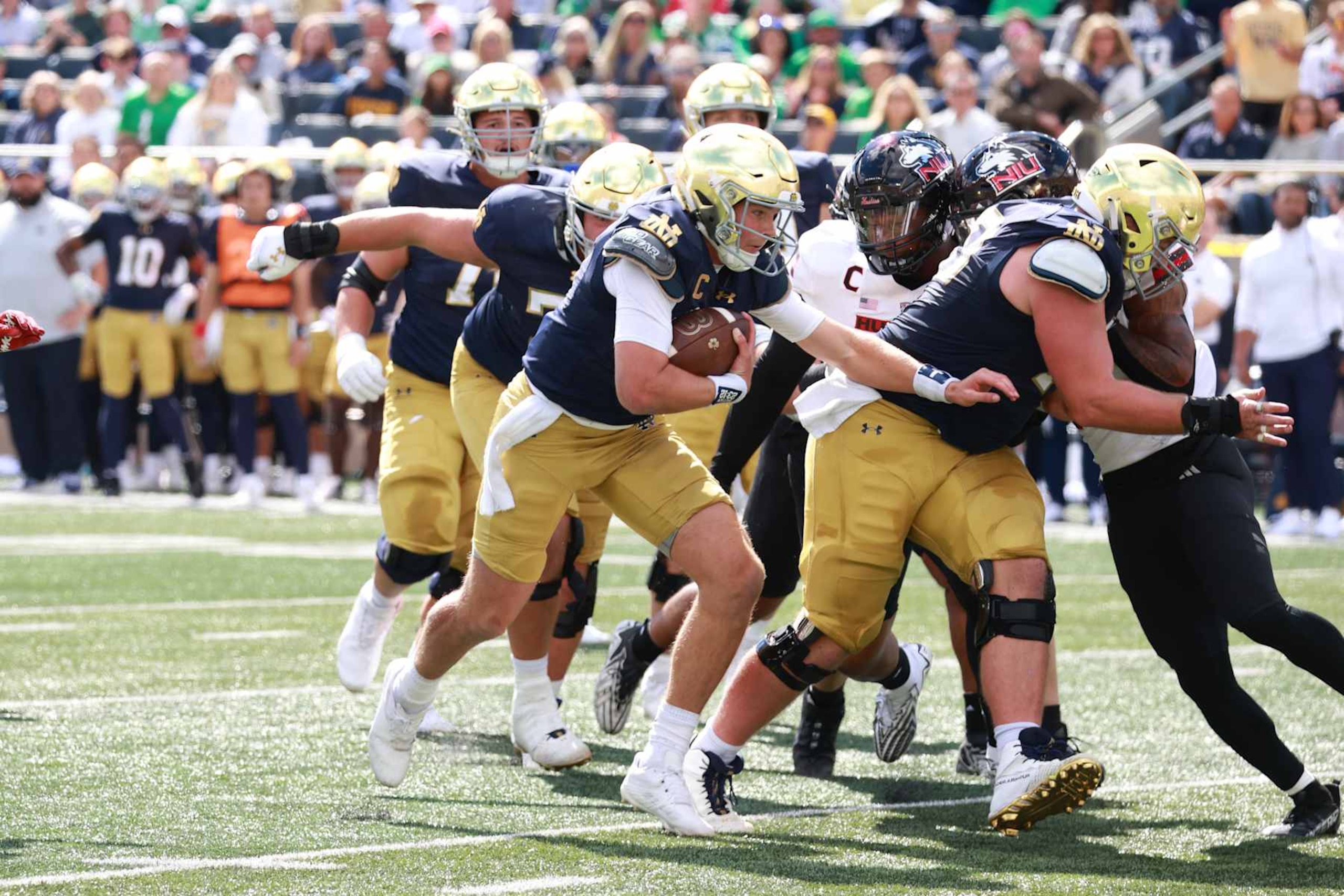 SOUTH BEND, IN - SEPTEMBER 07: Notre Dame Fighting Irish quarterback Riley Leonard (13) runs the ball in for a touchdown against the Northern Illinois Huskies on September 7, 2024, at Notre Dame Stadium in South Bend, Indiana. (Photo by Brian Spurlock/Icon Sportswire via Getty Images)