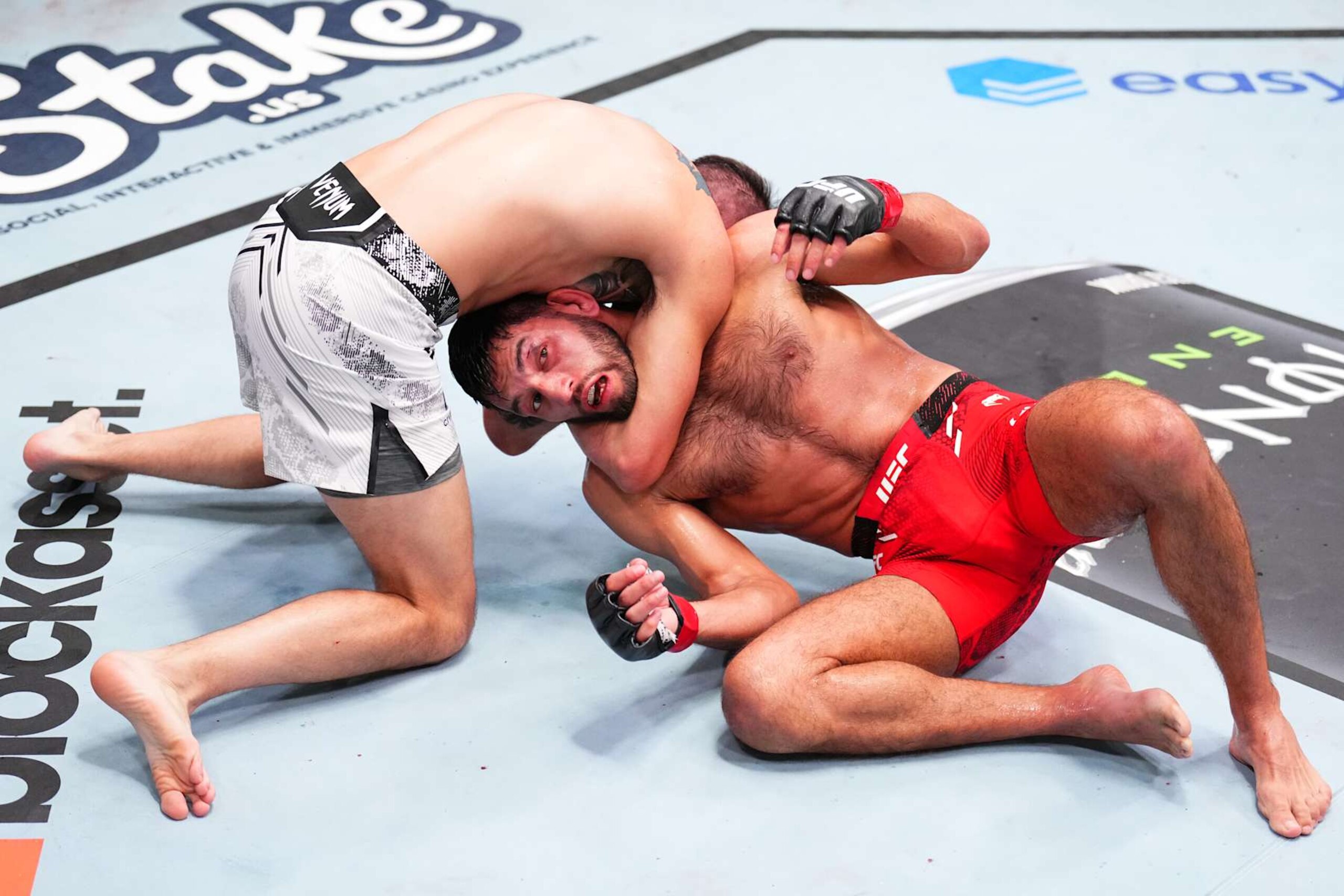 LAS VEGAS, NEVADA - SEPTEMBER 07: (L-R) Cody Durden secures a choke submission against Matt Schnell in a bantamweight fight during the UFC Fight Night event at UFC APEX on September 07, 2024 in Las Vegas, Nevada. (Photo by Chris Unger/Zuffa LLC via Getty Images)
