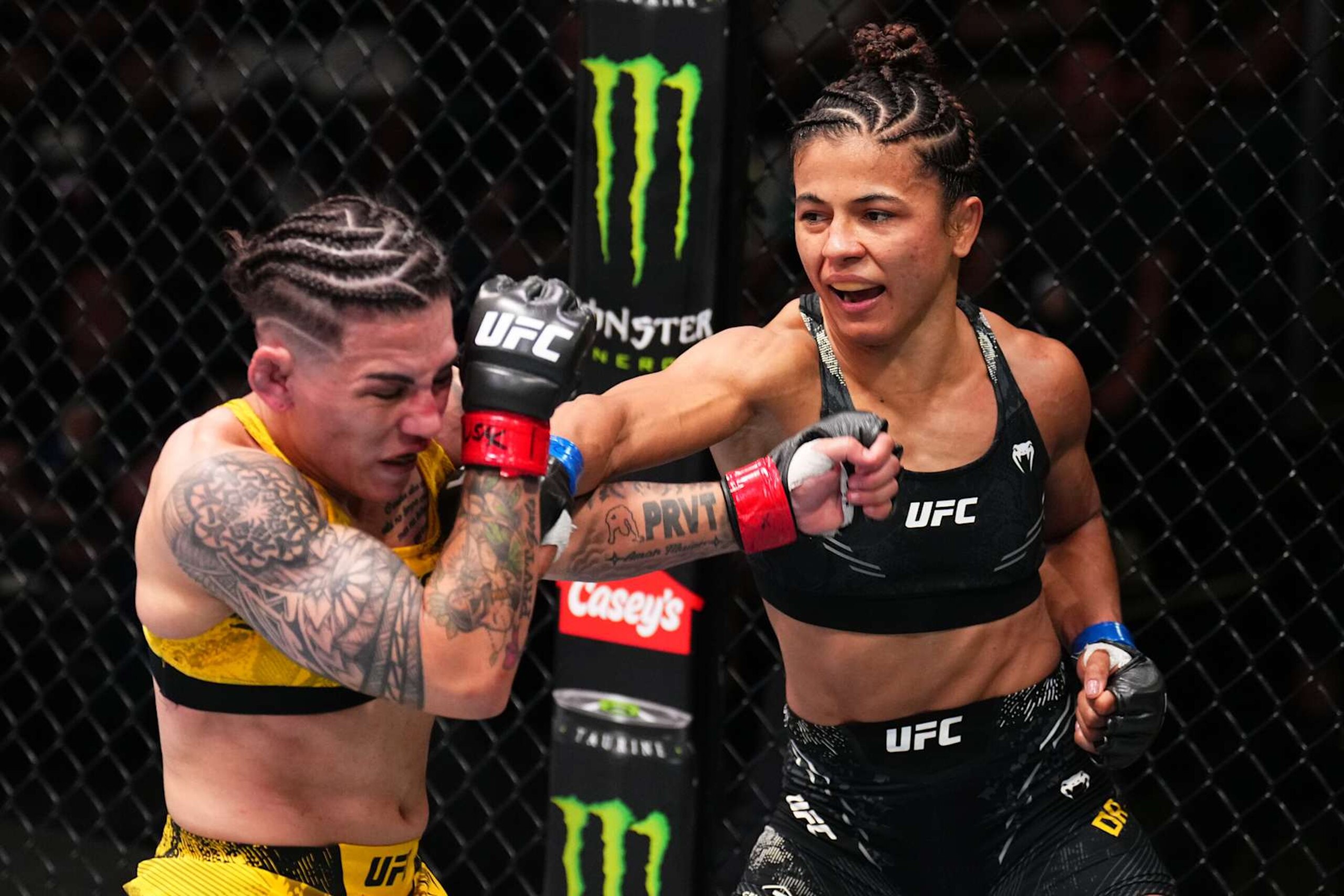 LAS VEGAS, NEVADA - SEPTEMBER 07: (R-L) Natalia Silva of Brazil punches Jessica Andrade of Brazil in a flyweight fight during the UFC Fight Night event at UFC APEX on September 07, 2024 in Las Vegas, Nevada. (Photo by Chris Unger/Zuffa LLC via Getty Images)