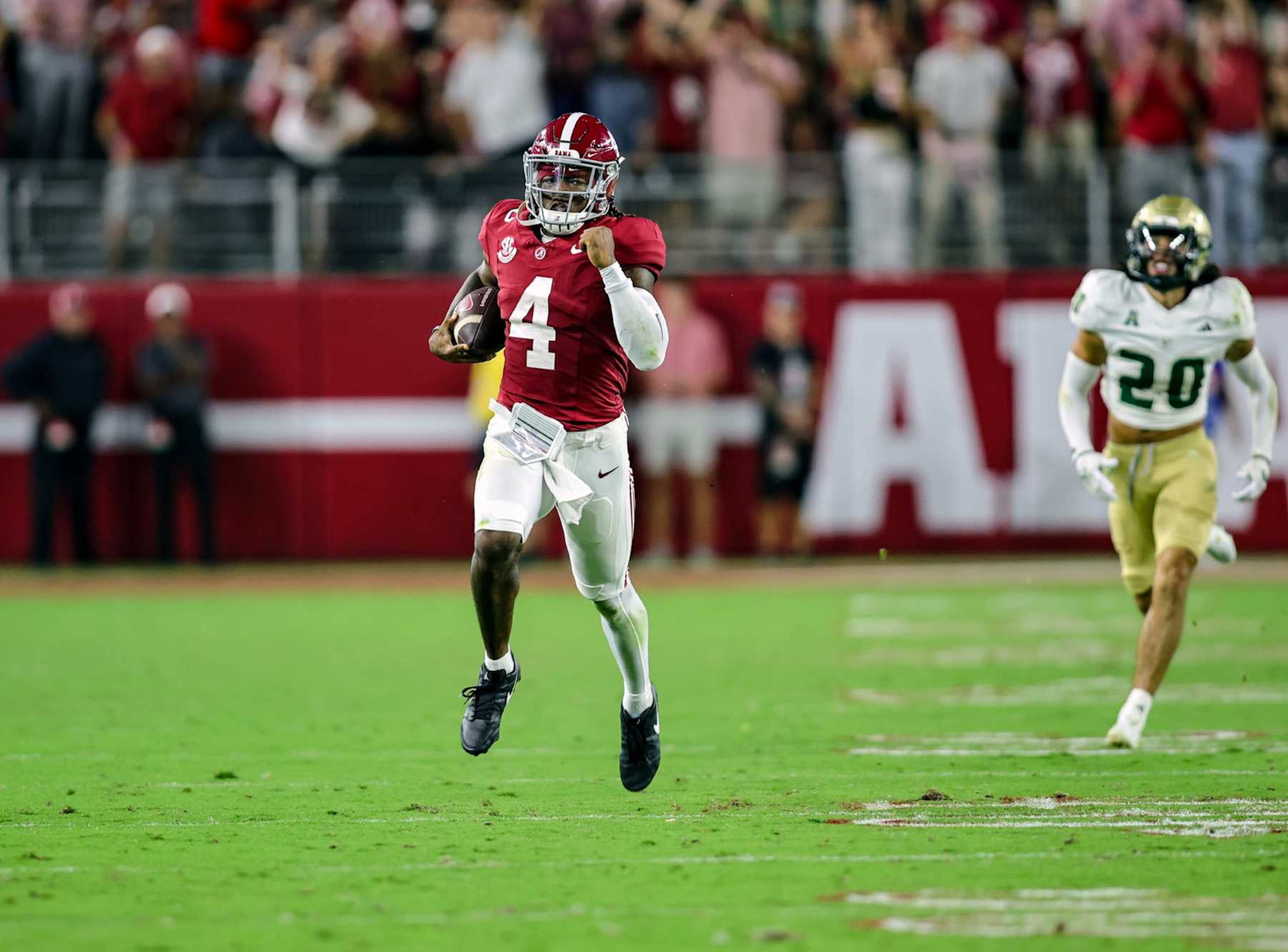 TUSCALOOSA, ALABAMA - SEPTEMBER 7: Jalen Milroe #4 of the Alabama Crimson Tide breaks loose for a long run during the first half against the South Florida Bulls at Bryant-Denny Stadium on September 7, 2024 in Tuscaloosa, Alabama. (Photo by Brandon Sumrall/Getty Images) TUSCALOOSA, ALABAMA - SEPTEMBER 7: Jalen Milroe #4 of the Alabama Crimson Tide breaks loose for a long run during the first half against the South Florida Bulls at Bryant-Denny Stadium on September 7, 2024 in Tuscaloosa, Alabama. (Photo by Brandon Sumrall/Getty Images)
