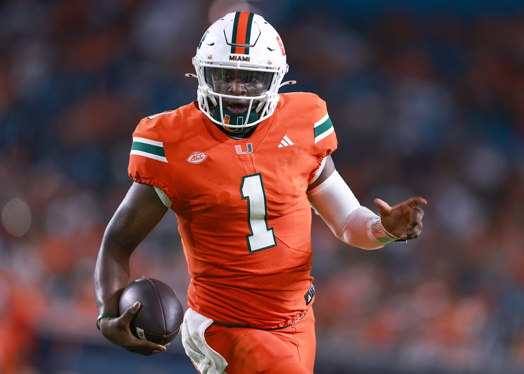 MIAMI GARDENS, FLORIDA - SEPTEMBER 07: Quarterback Cam Ward #1 of the Miami Hurricanes rushes for a touchdown against the Florida A&M Rattlers during the second half at Hard Rock Stadium on September 07, 2024 in Miami Gardens, Florida.  (Photo by Carmen Mandato/Getty Images)