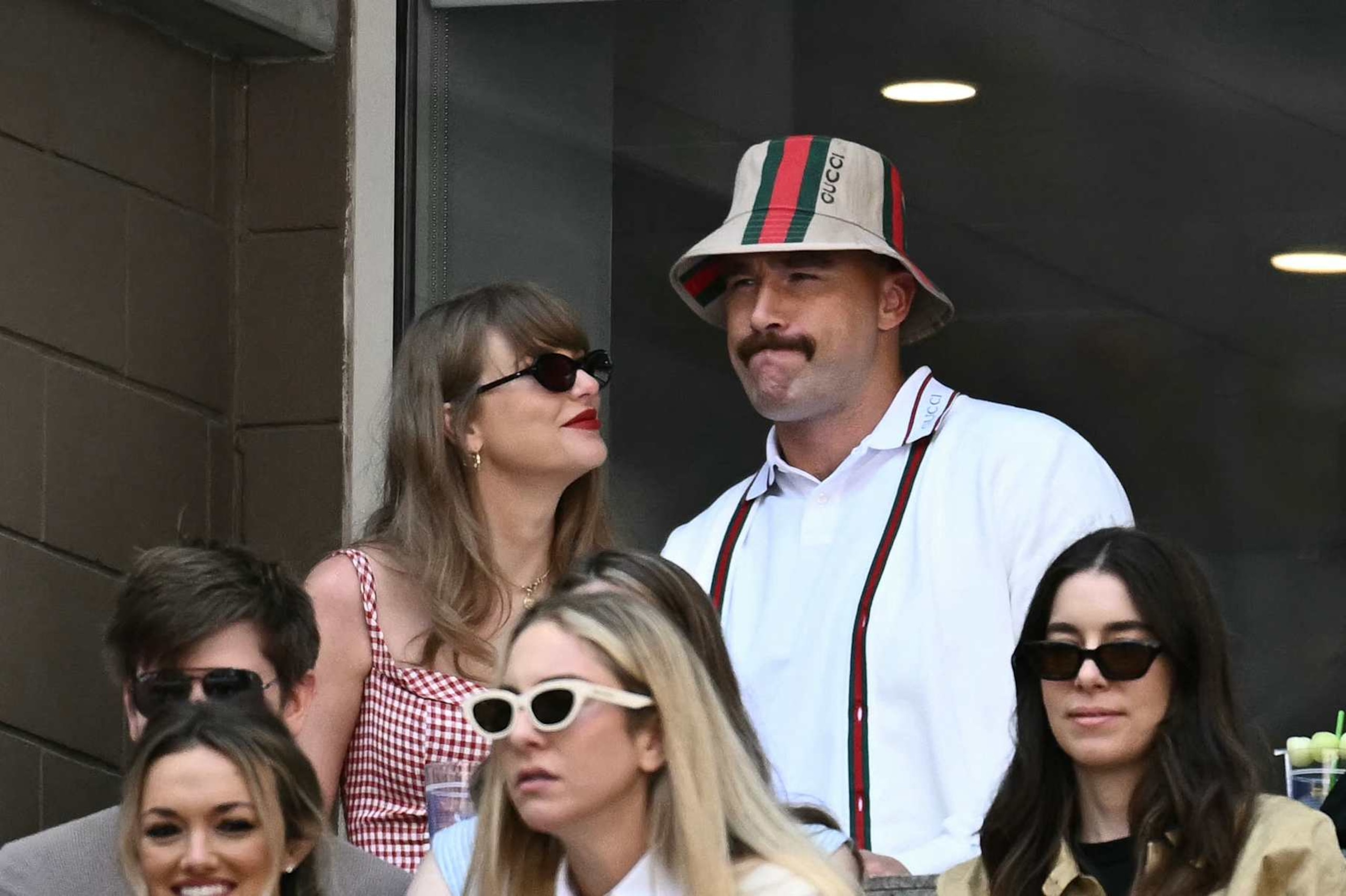 (L-R, back row) US musician Taylor Swift and US NFL football player Travis Kelce attend the men's final match between Italy's Jannik Sinner and USA's Taylor Fritz on day fourteen of the US Open tennis tournament at the USTA Billie Jean King National Tennis Center in New York City, on September 8, 2024. (Photo by ANGELA WEISS / AFP) (Photo by ANGELA WEISS/AFP via Getty Images) (L-R, back row) US musician Taylor Swift and US NFL football player Travis Kelce attend the men's final match between Italy's Jannik Sinner and USA's Taylor Fritz on day fourteen of the US Open tennis tournament at the USTA Billie Jean King National Tennis Center in New York City, on September 8, 2024. (Photo by ANGELA WEISS / AFP) (Photo by ANGELA WEISS/AFP via Getty Images)