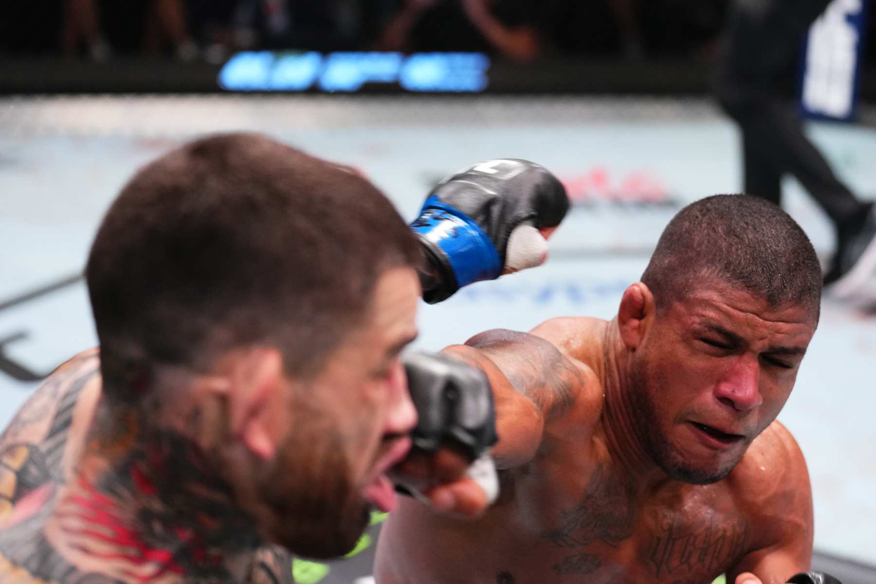 Gilbert Burns lands a punch on Sean Brady