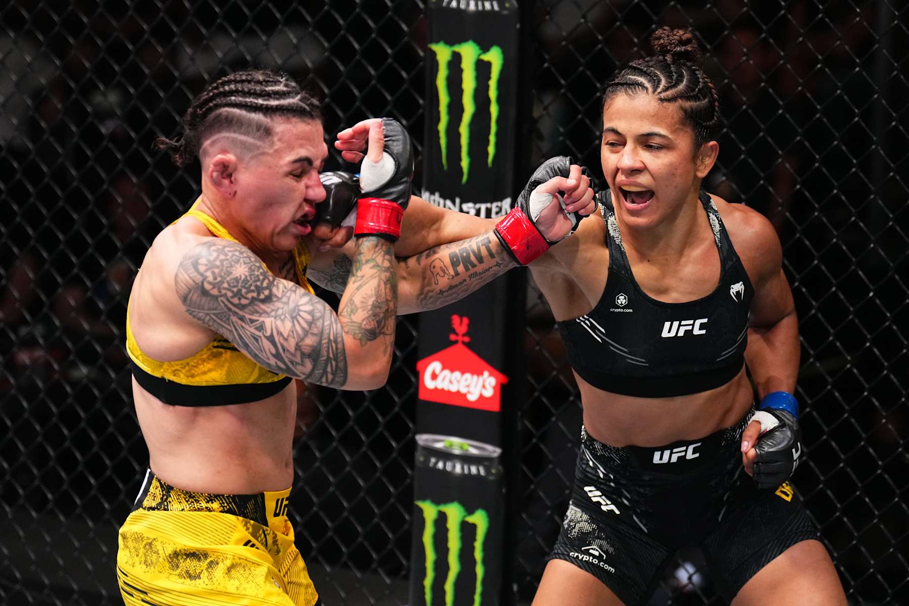 Natalia Silva of Brazil punches Jessica Andrade