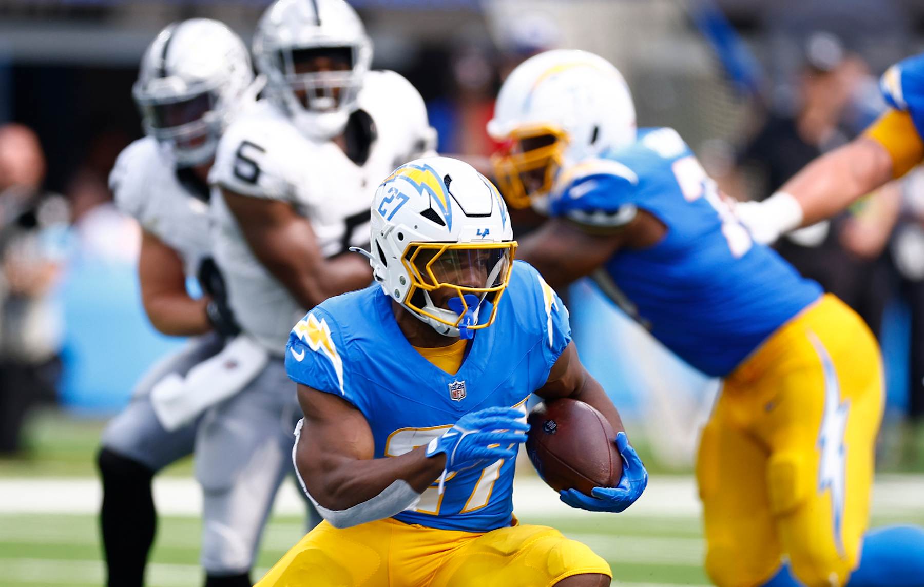 INGLEWOOD, CALIFORNIA - SEPTEMBER 08: J.K. Dobbins #27 of the Los Angeles Chargers runs the ball during the third quarter against the Las Vegas Raiders at SoFi Stadium on September 08, 2024 in Inglewood, California. (Photo by Ronald Martinez/Getty Images)