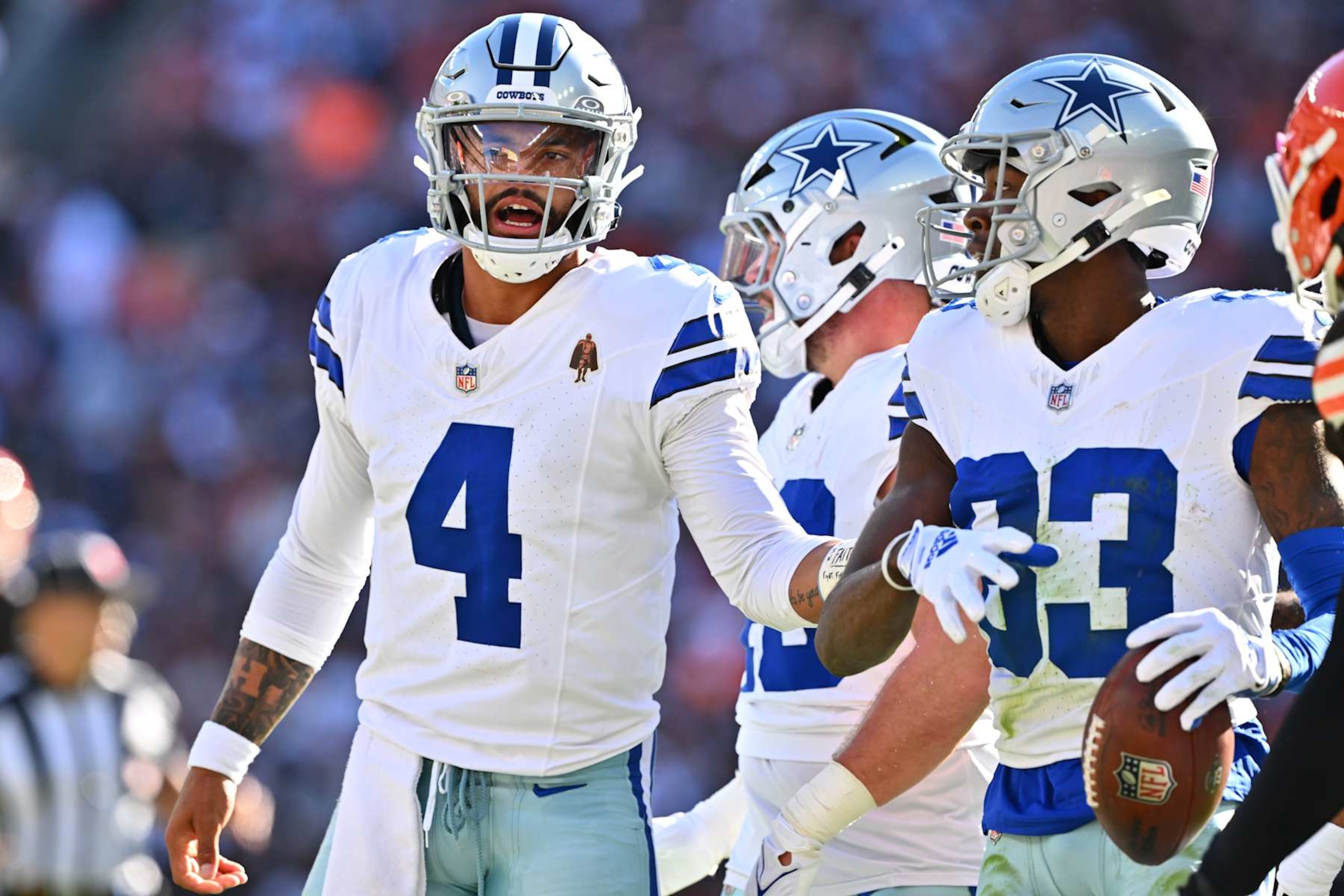 CLEVELAND, OHIO - SEPTEMBER 08: Dak Prescott #4 of the Dallas Cowboys reacts with Jalen Brooks #83 of the Dallas Cowboys after a play in the second quarter of the game against the Cleveland Browns at Cleveland Browns Stadium on September 08, 2024 in Cleveland, Ohio. (Photo by Jason Miller/Getty Images)