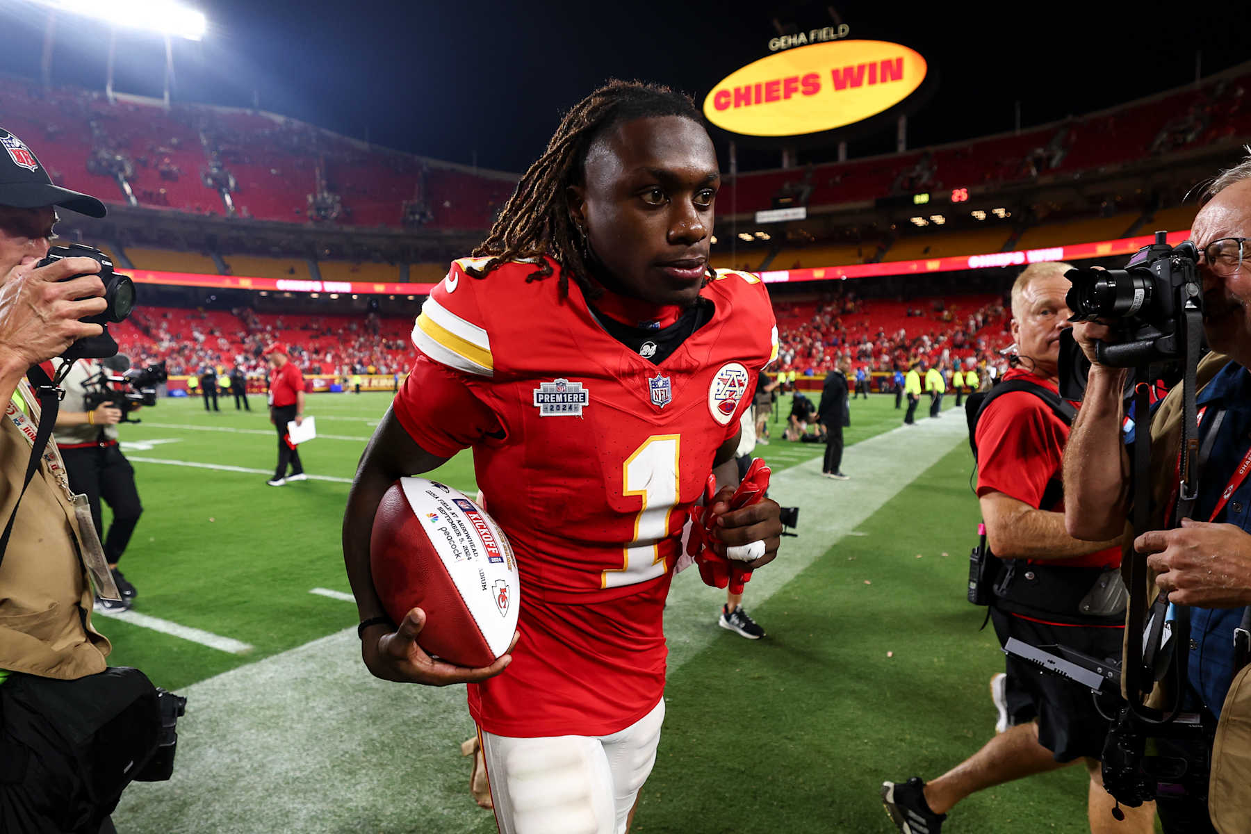 KANSAS CITY, MO - SEPTEMBER 5: Xavier Worthy #1 of the Kansas City Chiefs jogs off the field with a game ball after an NFL football game against the Baltimore Ravens at GEHA Field at Arrowhead Stadium on September 5, 2024 in Kansas City, Missouri. (Photo by Kevin Sabitus/Getty Images)