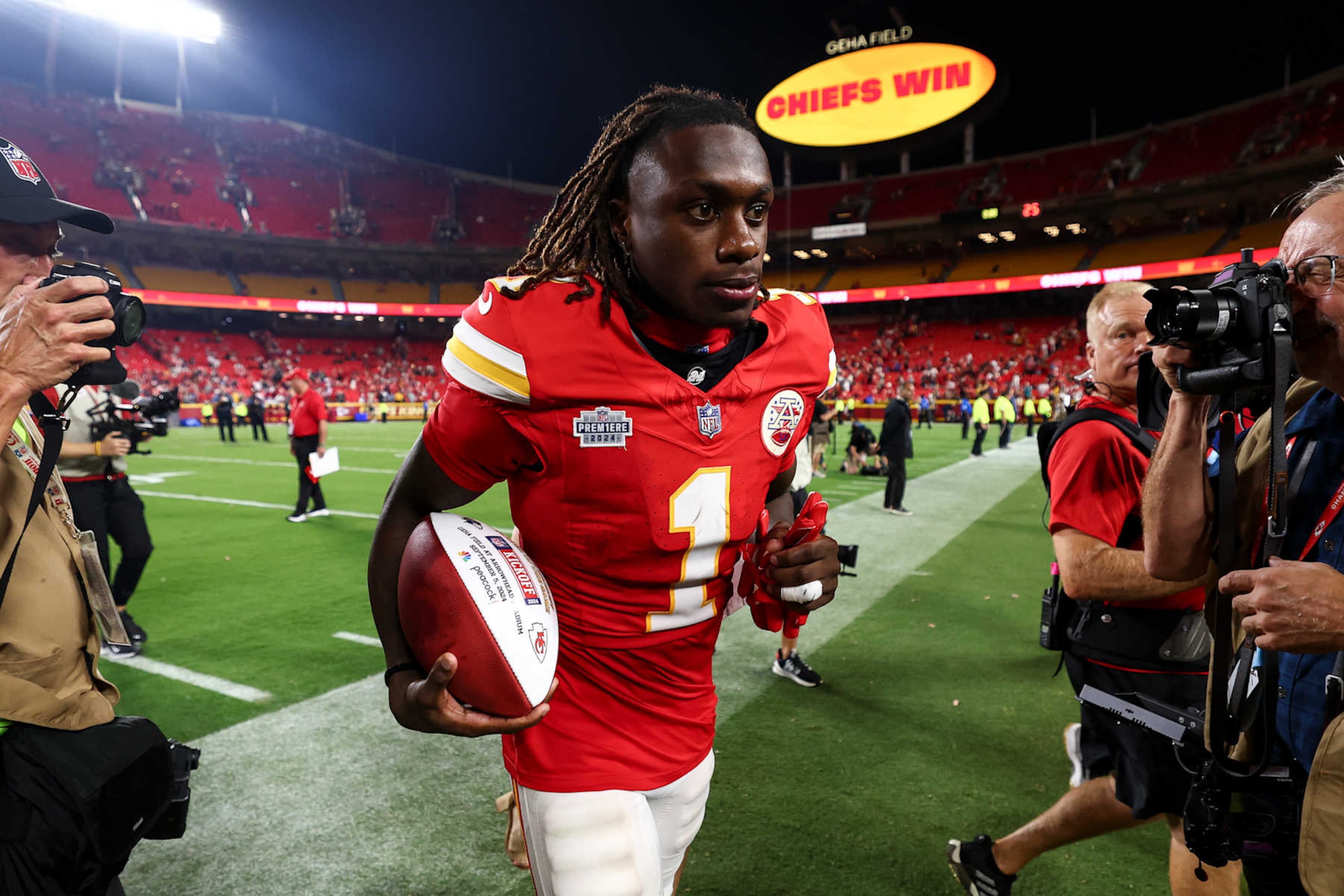 KANSAS CITY, MO - SEPTEMBER 5: Xavier Worthy #1 of the Kansas City Chiefs jogs off the field with a game ball after an NFL football game against the Baltimore Ravens at GEHA Field at Arrowhead Stadium on September 5, 2024 in Kansas City, Missouri. (Photo by Kevin Sabitus/Getty Images)