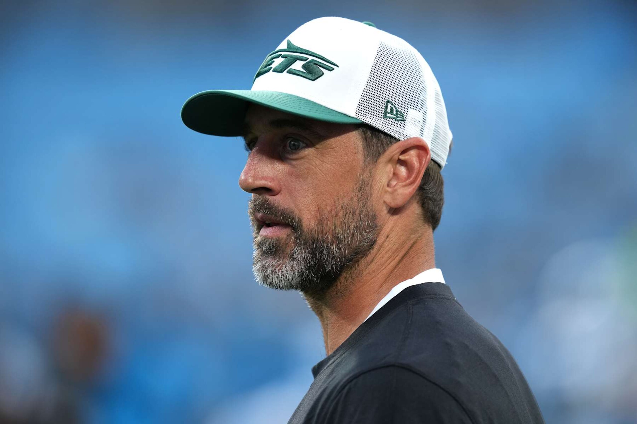 CHARLOTTE, NORTH CAROLINA - AUGUST 17: Aaron Rodgers #8 of the New York Jets looks on before their preseason game against the Carolina Panthers at Bank of America Stadium on August 17, 2024 in Charlotte, North Carolina. (Photo by Grant Halverson/Getty Images)