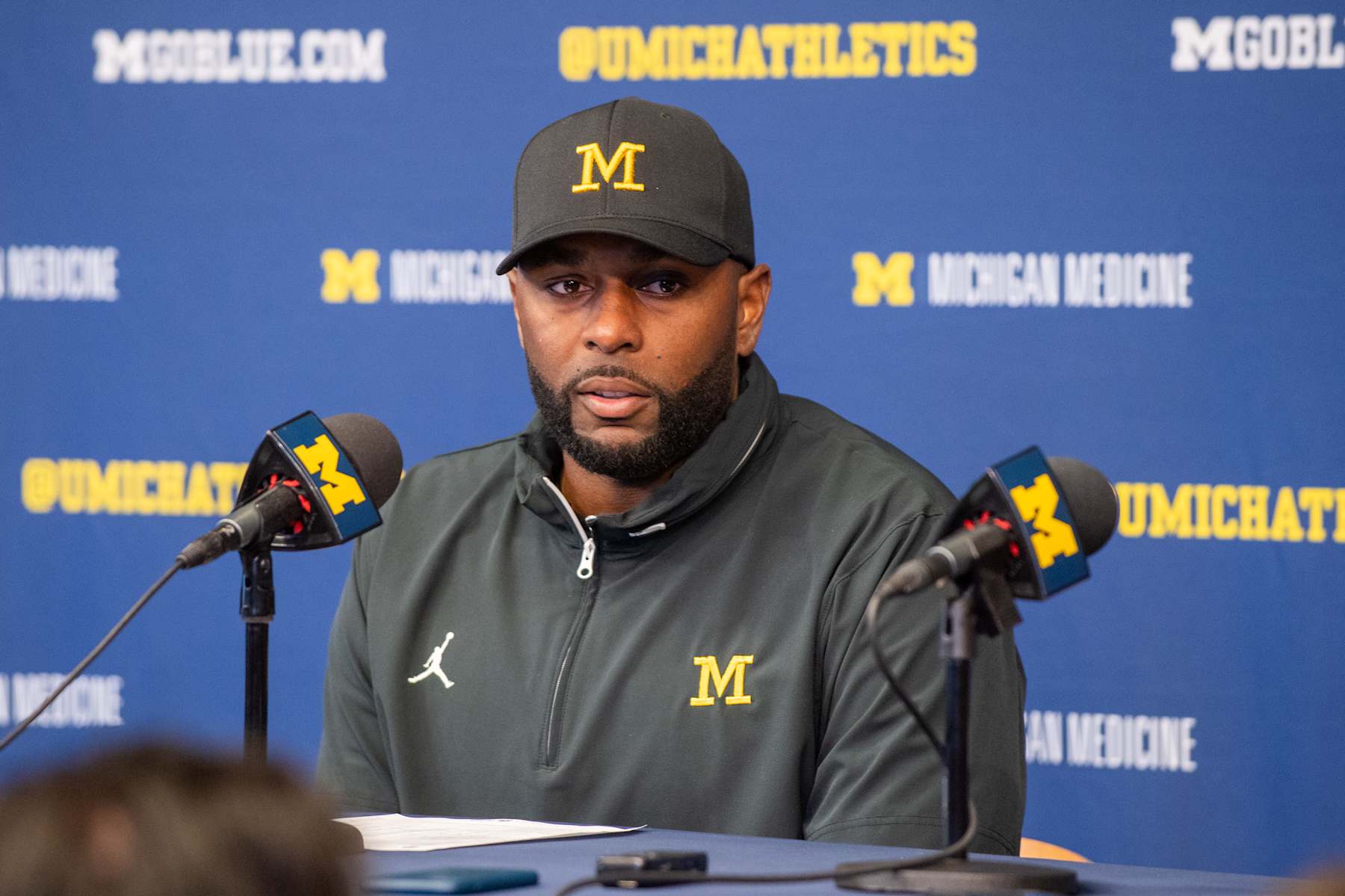 ANN ARBOR, MICHIGAN - SEPTEMBER 07: Head Football Coach Sherrone Moore of the Michigan Wolverines speaks to media during the post game press conference after a college football game against the Texas Longhorns at Michigan Stadium on September 07, 2024 in Ann Arbor, Michigan. The Texas Longhorns won the game 31-12. (Photo by Aaron J. Thornton/Getty Images)