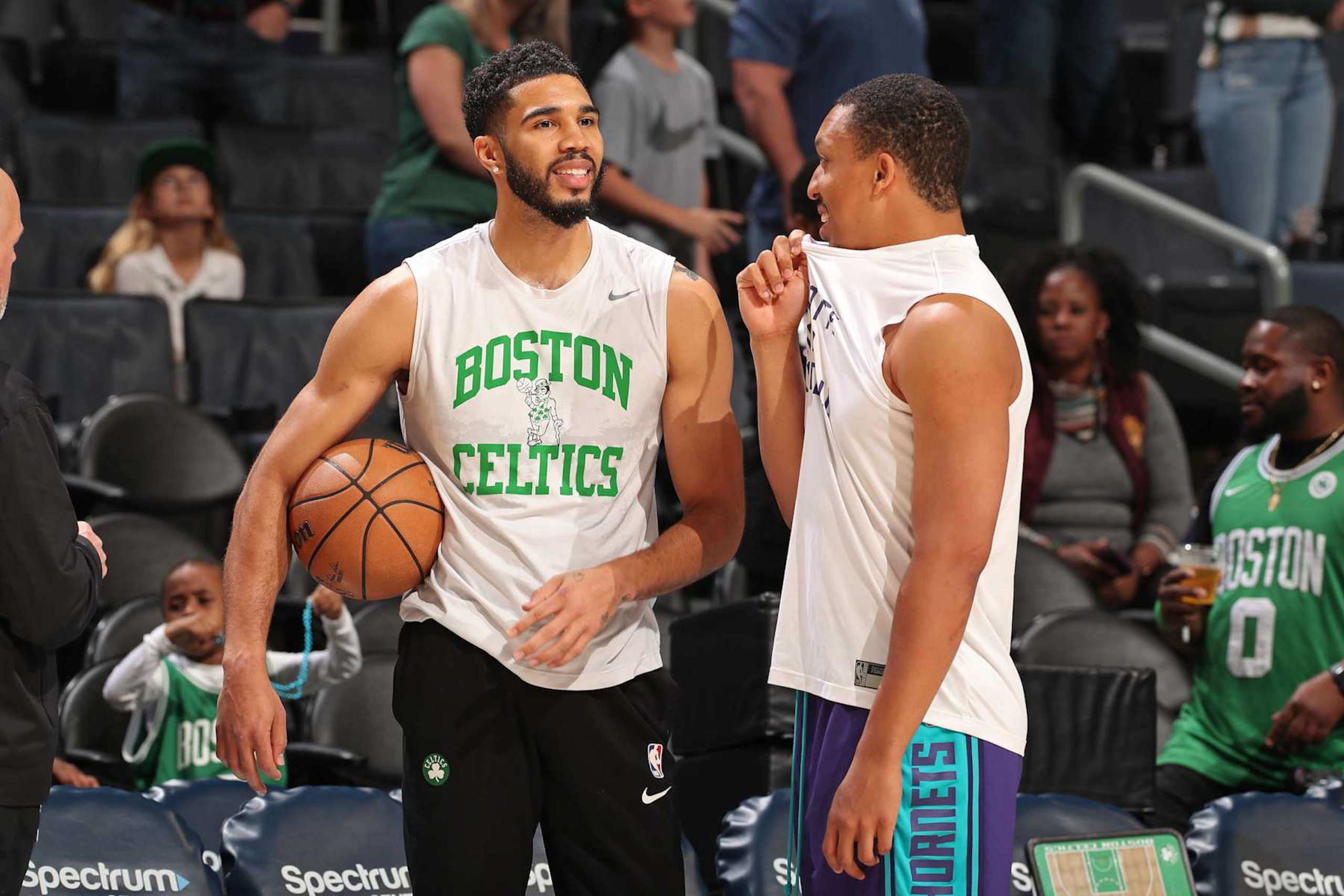 CHARLOTTE, NC - APRIL 1: Jayson Tatum #0 of the Boston Celtics and Grant Williams #2 of the Charlotte Hornets talk before the game on April 1, 2024 at Spectrum Center in Charlotte, North Carolina. NOTE TO USER: User expressly acknowledges and agrees that, by downloading and or using this photograph, User is consenting to the terms and conditions of the Getty Images License Agreement. Mandatory Copyright Notice: Copyright 2024 NBAE (Photo by Kent Smith/NBAE via Getty Images)