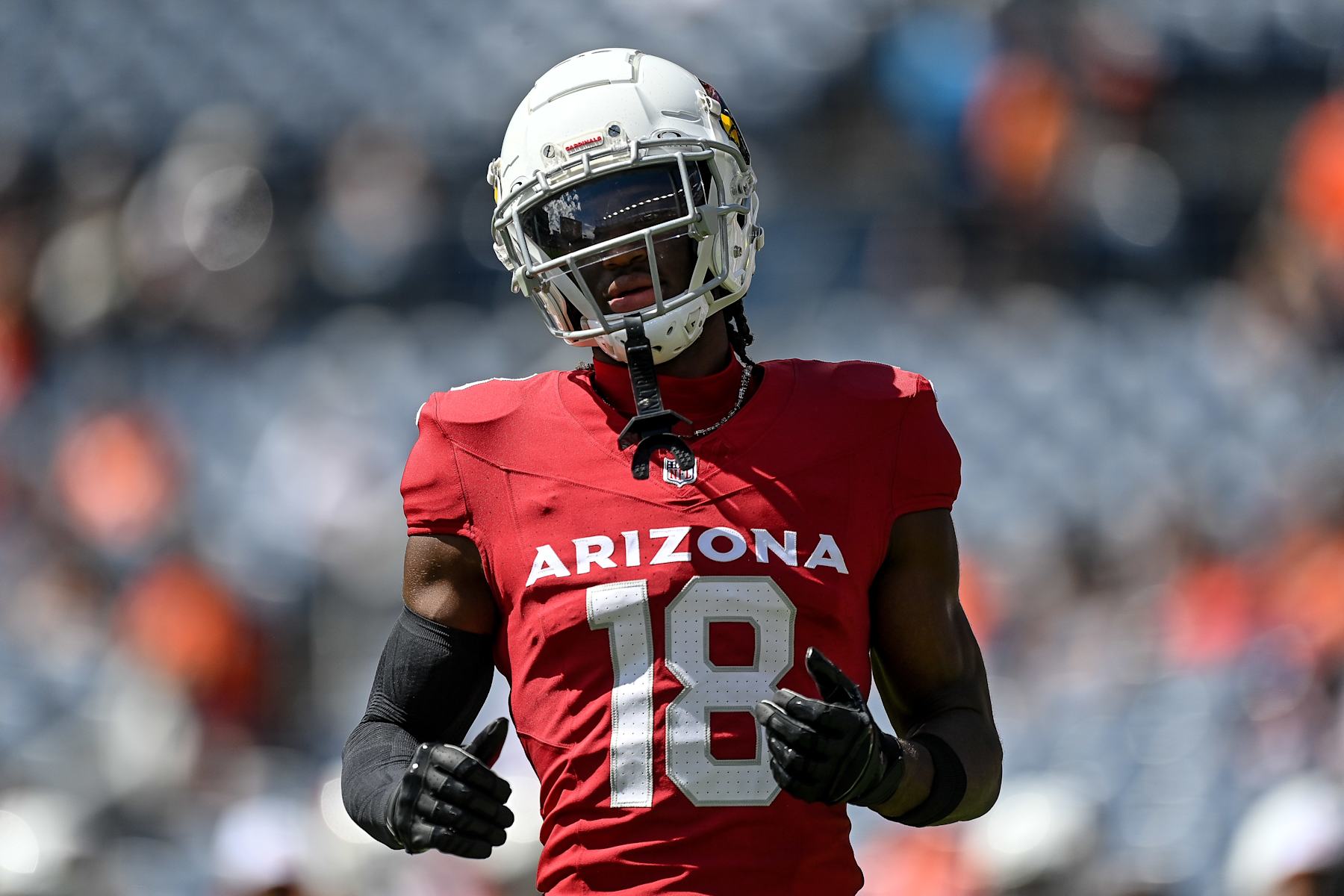DENVER, COLORADO - AUGUST 25:  Marvin Harrison Jr. #18 of the Arizona Cardinals warms up before the preseason game against the Denver Broncos at Empower Field at Mile High on August 25, 2024 in Denver, Colorado. (Photo by Dustin Bradford/Getty Images)