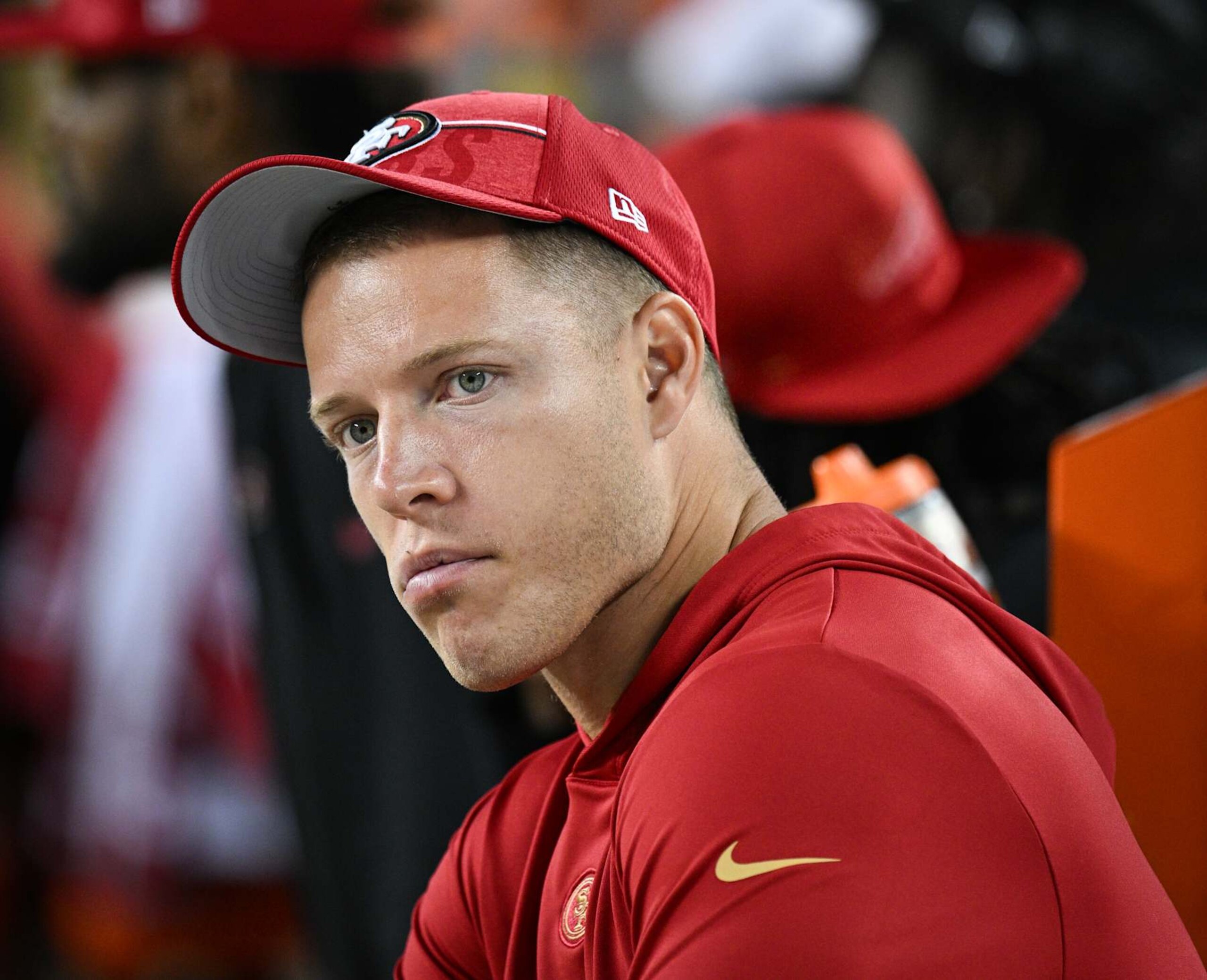 SANTA CLARA, CALIFORNIA - AUGUST 25: Christian McCaffrey #23 of the San Francisco 49ers looks on from the sideline during the second half of a preseason game against the Los Angeles Chargers at Levi's Stadium on August 25, 2023 in Santa Clara, California. (Photo by Loren Elliott/Getty Images)