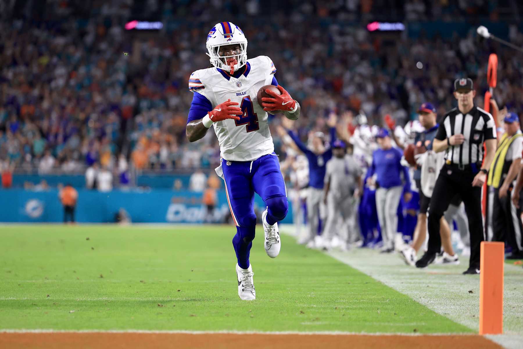 MIAMI GARDENS, FLORIDA - SEPTEMBER 12: James Cook #4 of the Buffalo Bills scores a touchdown against the Miami Dolphins during the first quarter in the game at Hard Rock Stadium on September 12, 2024 in Miami Gardens, Florida. (Photo by Carmen Mandato/Getty Images)