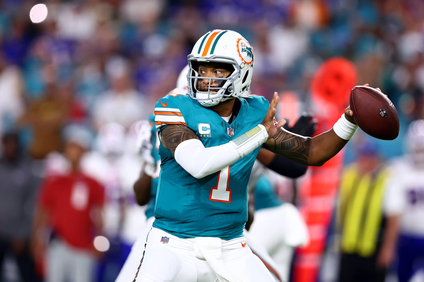 MIAMI GARDENS, FLORIDA - SEPTEMBER 12: Tua Tagovailoa #1 of the Miami Dolphins looks to pass against the Buffalo Bills during the first quarter in the game at Hard Rock Stadium on September 12, 2024 in Miami Gardens, Florida. (Photo by Megan Briggs/Getty Images)
