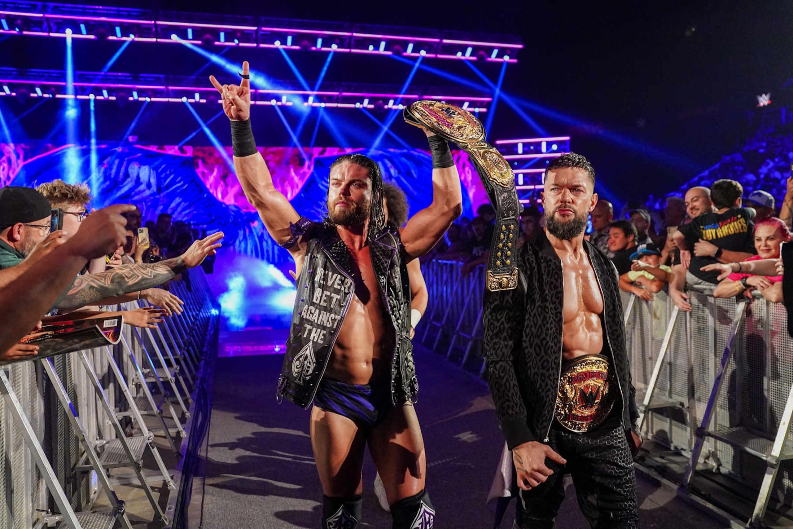 OTTAWA, CANADA - JULY 8: The World Tag Team Champions, JD McDonagh and Finn Balor of the Judgment Day enter the arena during Monday Night RAW at Canadian Tire Centre on July 8, 2024 in Ottawa, Ontario.  (Photo by WWE/Getty Images)