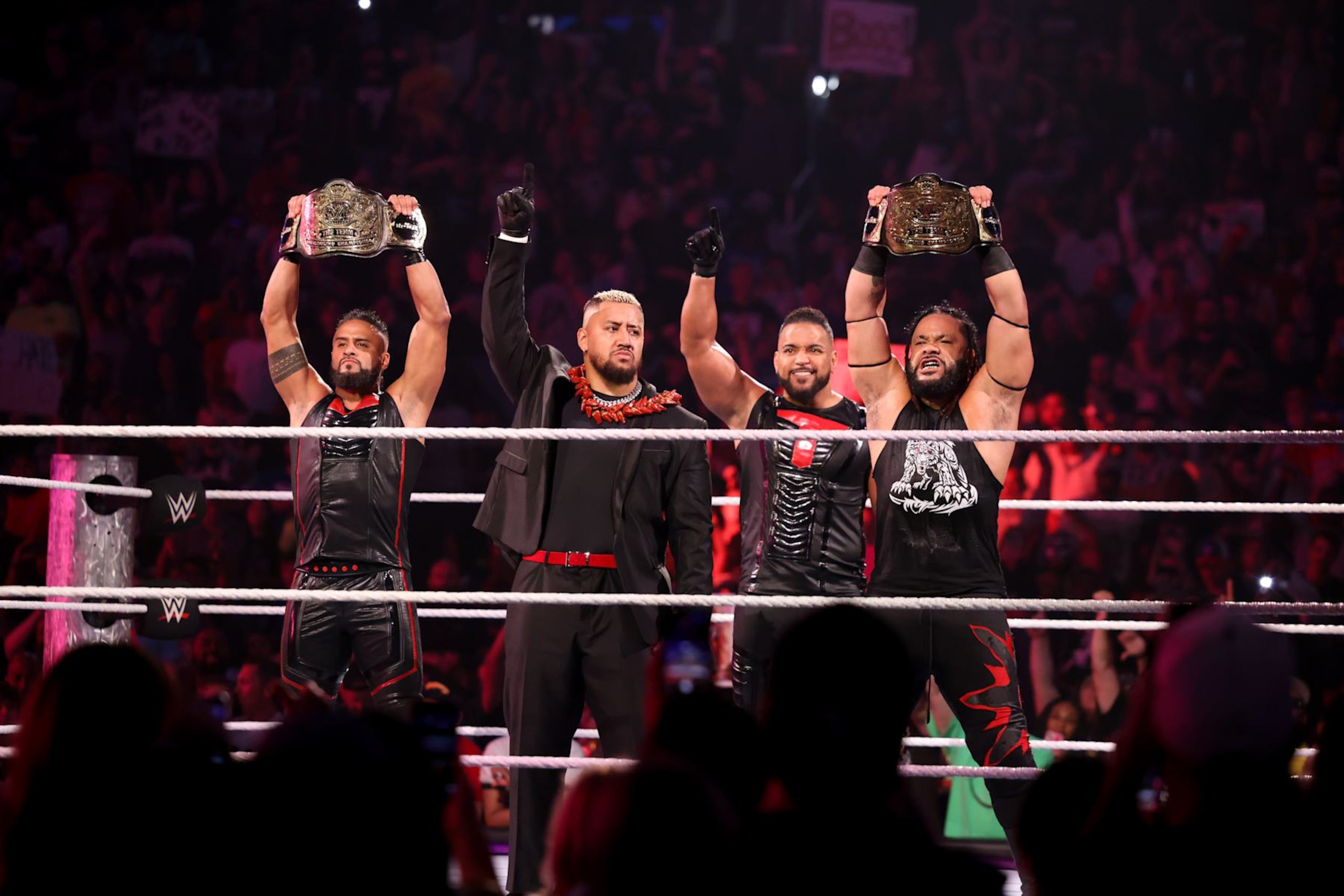 WASHINGTON, DC - AUGUST 23: WWE Tag Team Champions Tama Tonga, Solo Sikoa, Tonga Loa and Jacob Fatu (The Bloodline) make their entrance during SmackDown at Capital One Arena on August 23, 2024 in Washington, DC.  (Photo by WWE/Getty Images)