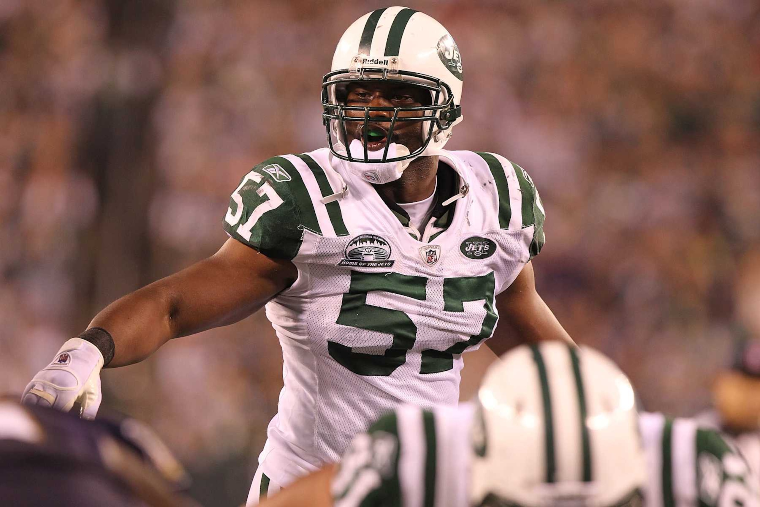 EAST RUTHERFORD, NJ - SEPTEMBER 13:  Linebacker Bart Scott #57 of the New York Jets follows the play against the Baltimore Ravens when the Jets host the Ravens on Monday Night Football at New Meadowlands Stadium on September 13, 2010 in East Rutherford, New Jersey. Ravens beat the Jetes, 10-9.  (Photo by Al Pereira/Getty Images)
