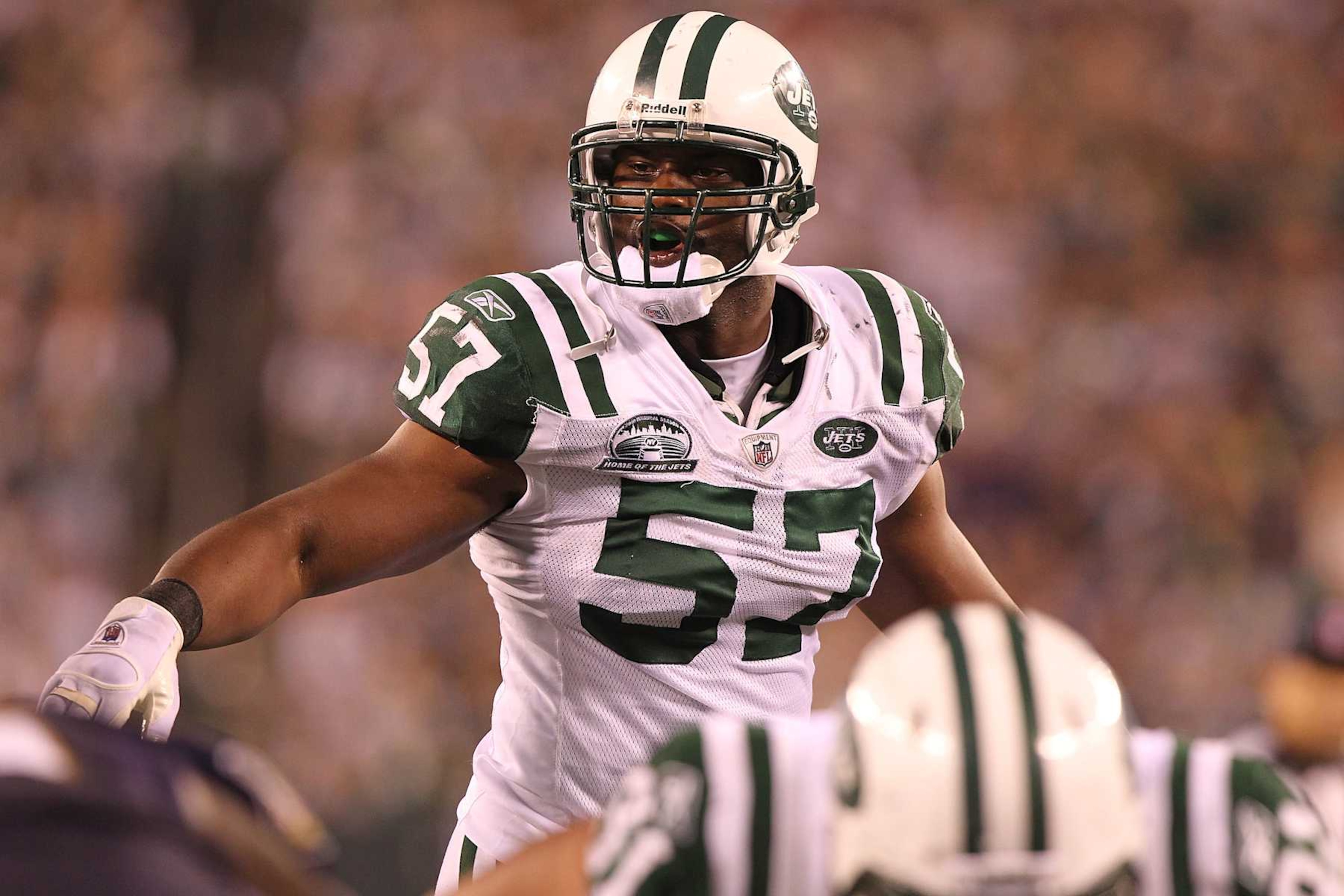 EAST RUTHERFORD, NJ - SEPTEMBER 13:  Linebacker Bart Scott #57 of the New York Jets follows the play against the Baltimore Ravens when the Jets host the Ravens on Monday Night Football at New Meadowlands Stadium on September 13, 2010 in East Rutherford, New Jersey. Ravens beat the Jetes, 10-9.  (Photo by Al Pereira/Getty Images)