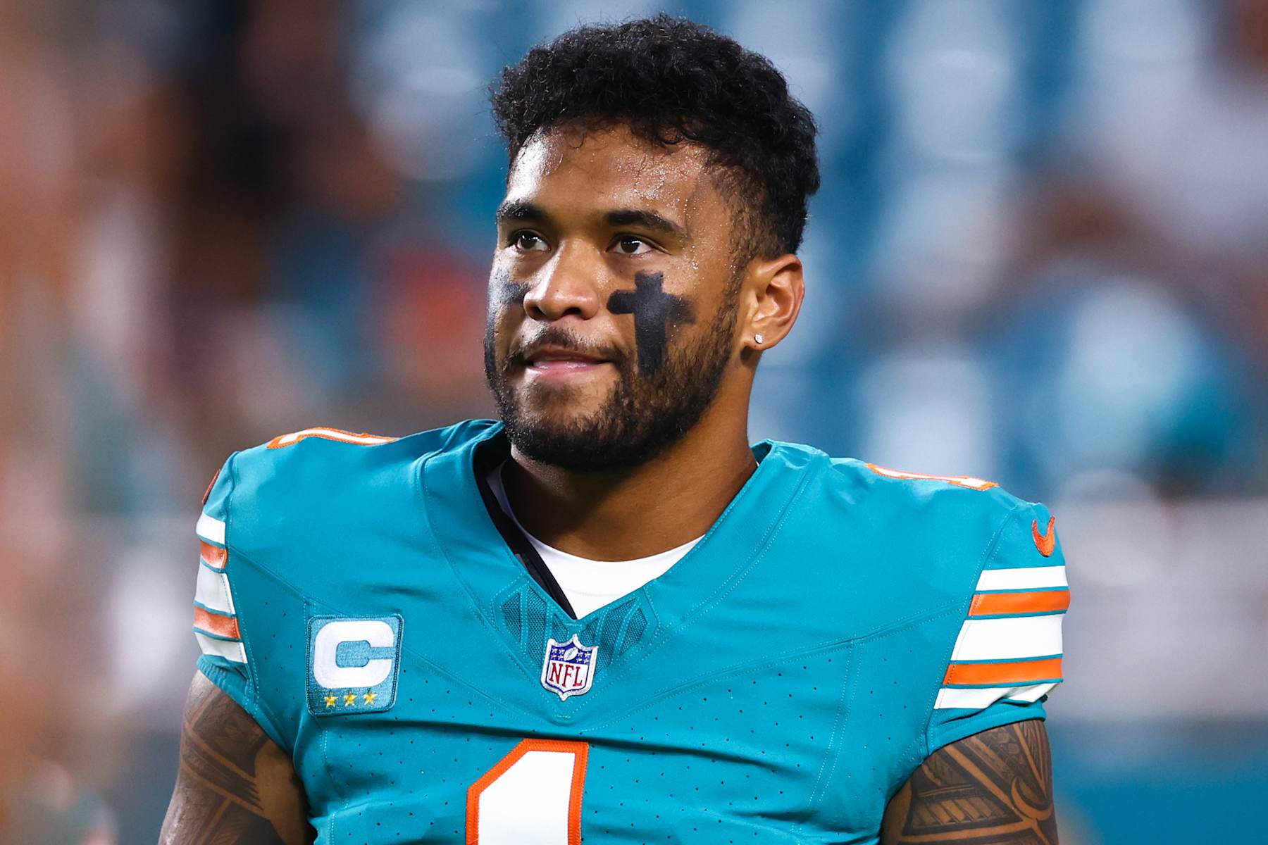MIAMI GARDENS, FLORIDA - SEPTEMBER 12: Tua Tagovailoa #1 of the Miami Dolphins looks on prior to playing a game against the Buffalo Bills at Hard Rock Stadium on September 12, 2024 in Miami Gardens, Florida. (Photo by Megan Briggs/Getty Images)