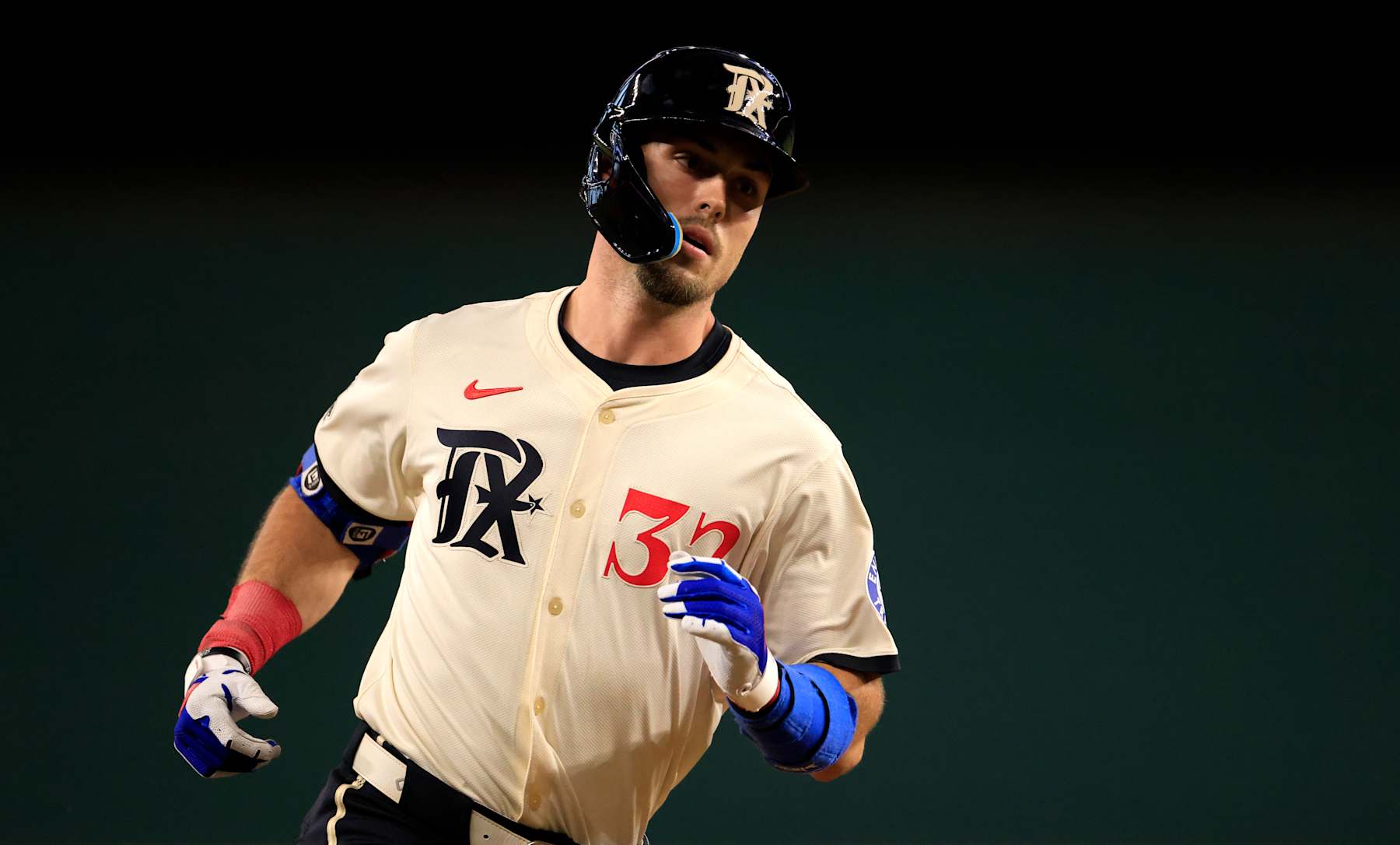 ARLINGTON, TX - APRIL 26: Evan Carter #32 of the Texas Rangers rounds the bases after hitting a solo home run against the Cincinnati Reds during the second inning at Globe Life Field on April 26, 2024 in Arlington, Texas. (Photo by Ron Jenkins/Getty Images) ARLINGTON, TX - APRIL 26: Evan Carter #32 of the Texas Rangers rounds the bases after hitting a solo home run against the Cincinnati Reds during the second inning at Globe Life Field on April 26, 2024 in Arlington, Texas. (Photo by Ron Jenkins/Getty Images)