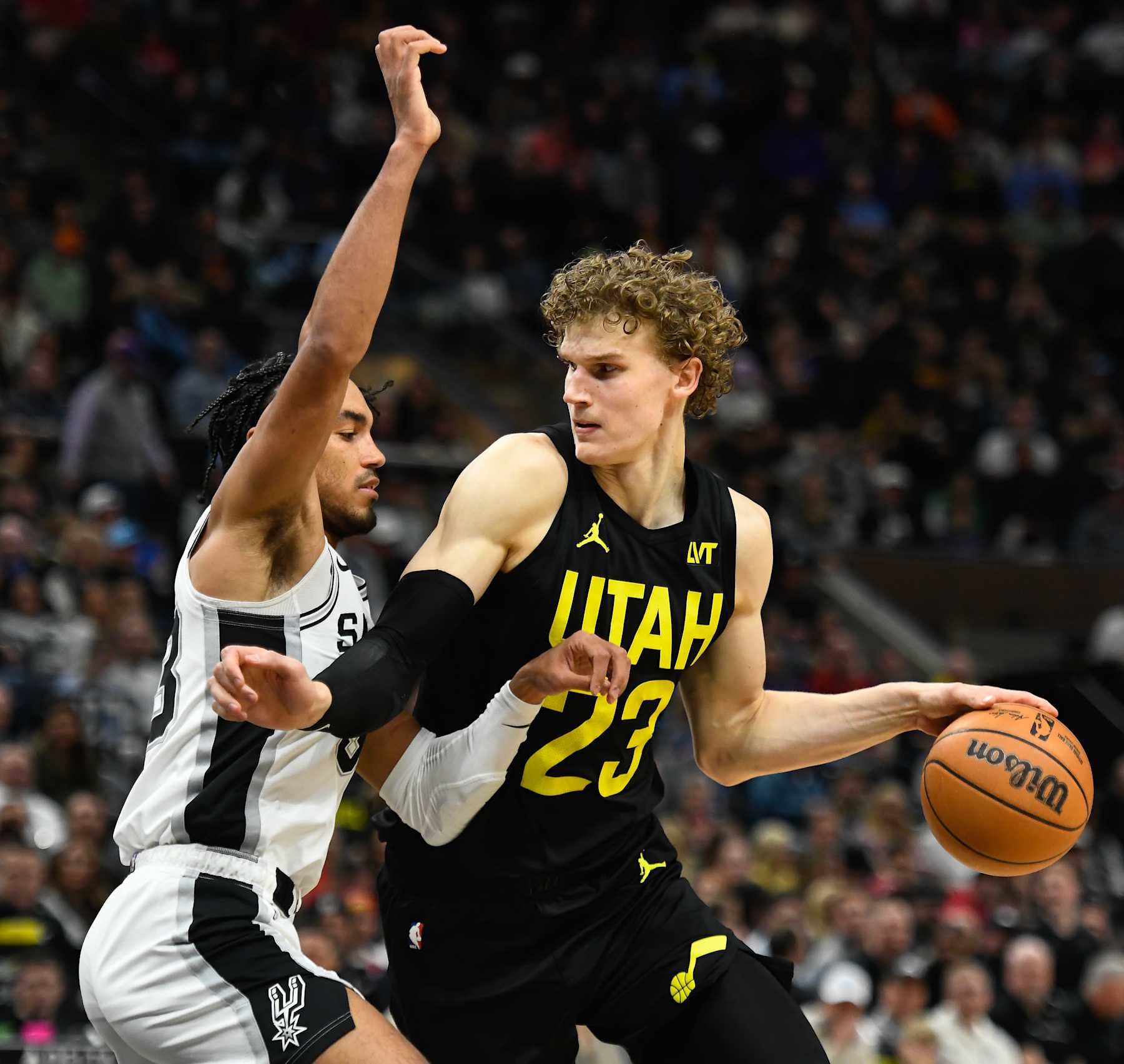 SALT LAKE CITY, UTAH - MARCH 27: Lauri Markkanen #23 of the Utah Jazz in action with Tre Jones #33 of the San Antonio Spurs during the second half of a game at Delta Center on March 27, 2024 in Salt Lake City, Utah. NOTE TO USER: User expressly acknowledges and agrees that, by downloading and or using this photograph, User is consenting to the terms and conditions of the Getty Images License Agreement. (Photo by Alex Goodlett/Getty Images)