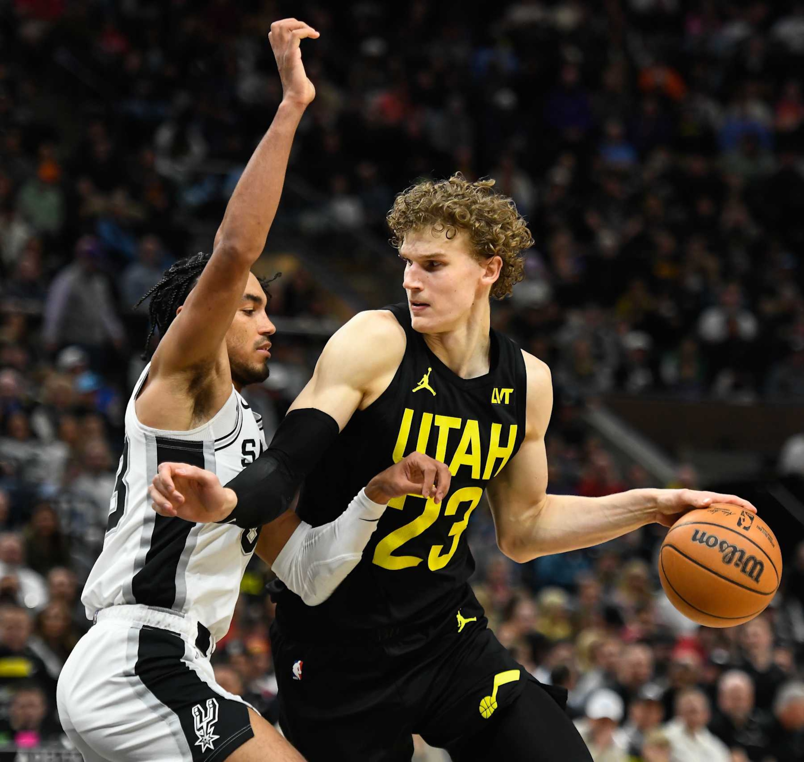 SALT LAKE CITY, UTAH - MARCH 27: Lauri Markkanen #23 of the Utah Jazz in action with Tre Jones #33 of the San Antonio Spurs during the second half of a game at Delta Center on March 27, 2024 in Salt Lake City, Utah. NOTE TO USER: User expressly acknowledges and agrees that, by downloading and or using this photograph, User is consenting to the terms and conditions of the Getty Images License Agreement. (Photo by Alex Goodlett/Getty Images)
