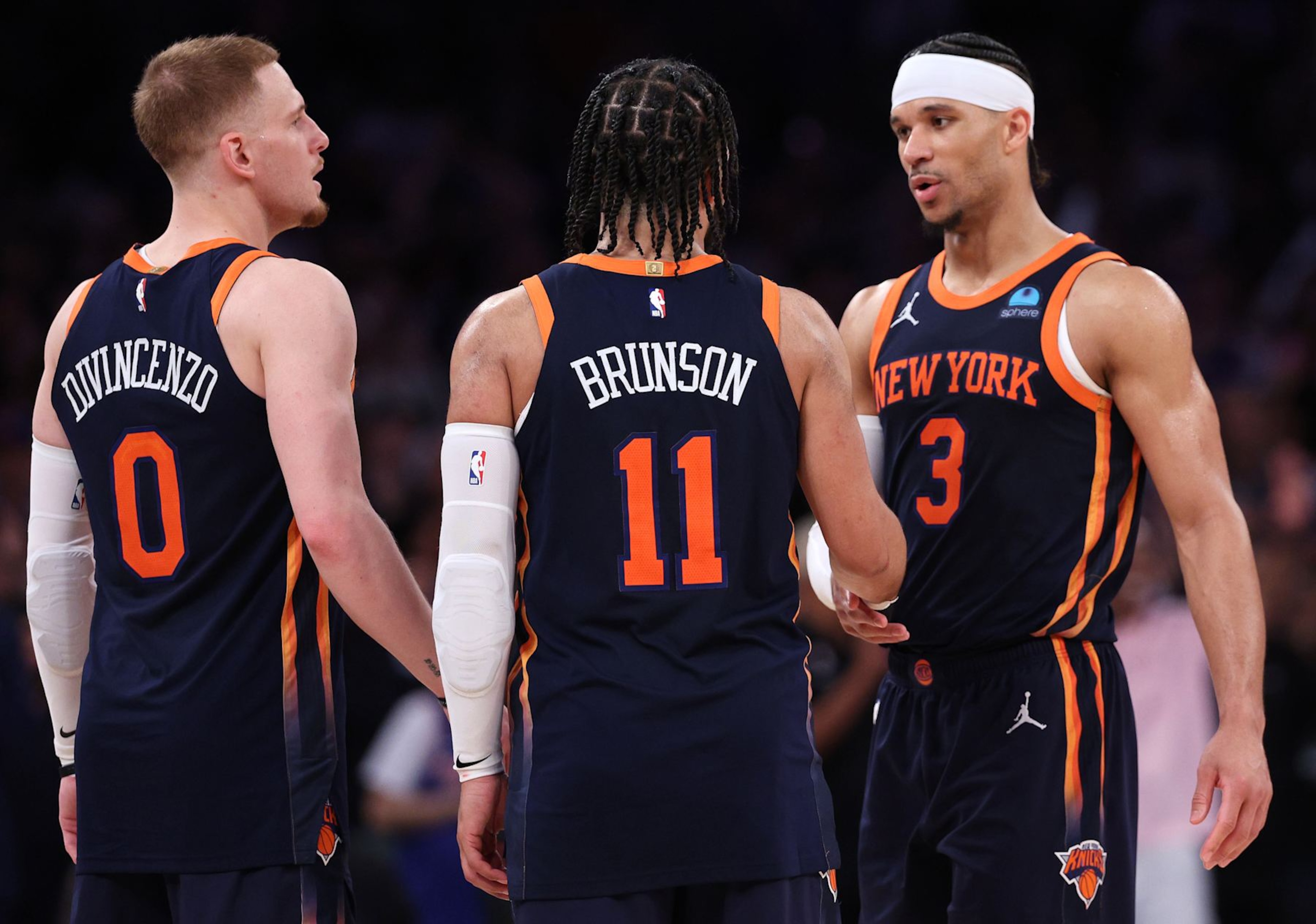 NEW YORK, NEW YORK - MAY 08: Donte DiVincenzo #0, Jalen Brunson #11 and Josh Hart #3 of the New York Knicks celebrate their win against the Indiana Pacers in Game Two of the Eastern Conference Second Round Playoffs at Madison Square Garden on May 08, 2024 in New York City. NOTE TO USER: User expressly acknowledges and agrees that, by downloading and or using this photograph, User is consenting to the terms and conditions of the Getty Images License Agreement. (Photo by Elsa/Getty Images)