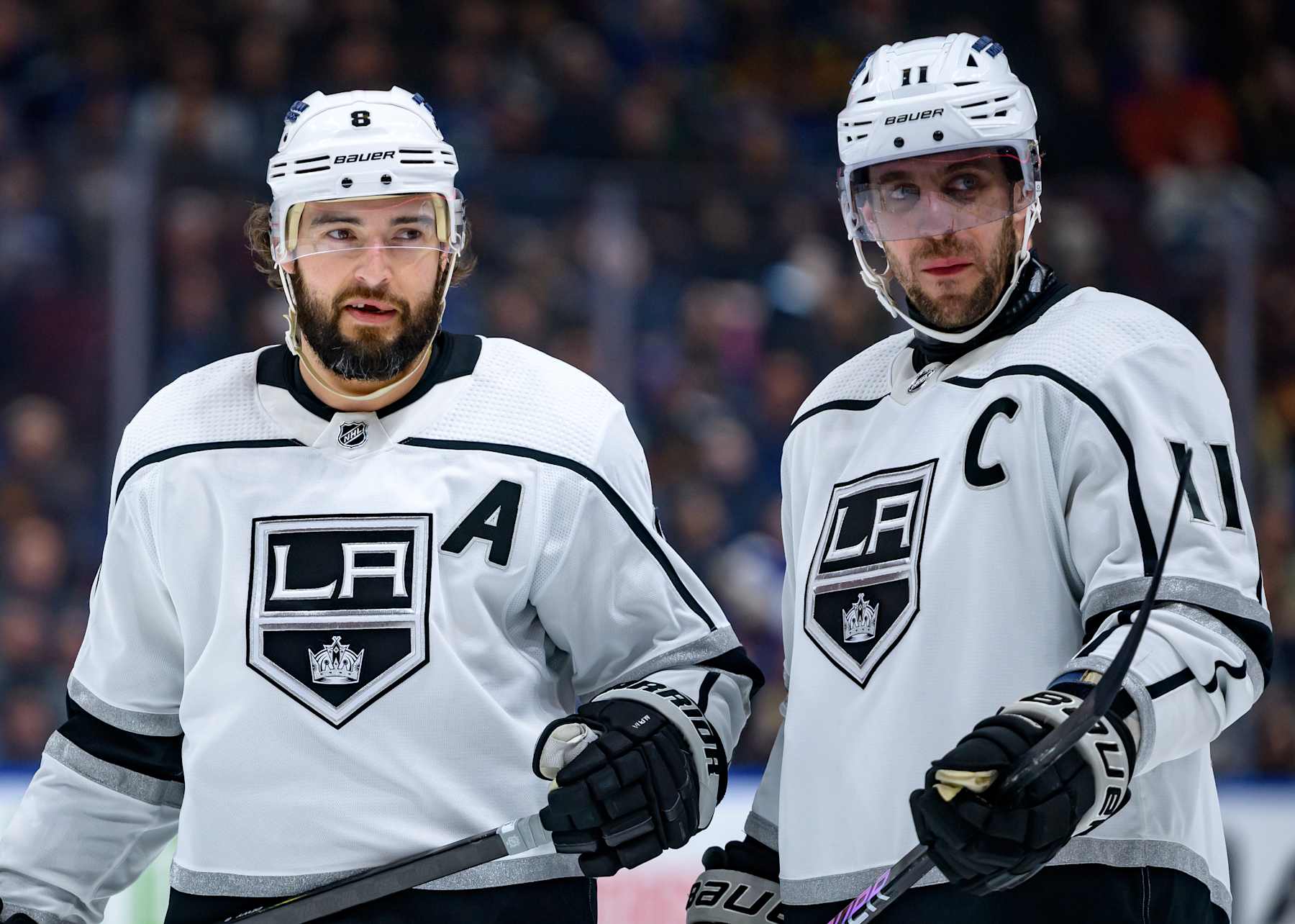 VANCOUVER, CANADA - FEBRUARY 29: Drew Doughty #8 and Anze Kopitar #11 of the Los Angeles Kings wait for a face-off during the second period of the NHL game against the Vancouver Canucks at Rogers Arena on February 29, 2024 in Vancouver, Canada. (Photo by Derek Cain/Getty Images)