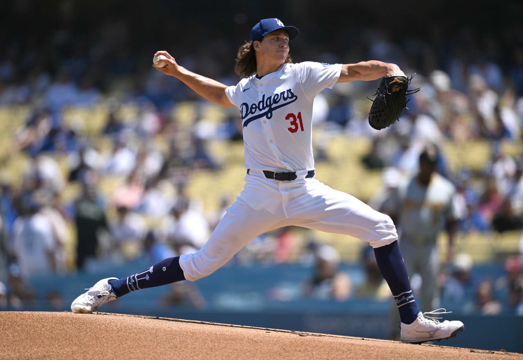 LOS ANGELES, CALIFORNIA - AUGUST 11: Tyler Glasnow #31 of the Los Angeles Dodgers pitches against the Pittsburgh Pirates in the first inning at Dodger Stadium on August 11, 2024 in Los Angeles, California. (Photo by John McCoy/Getty Images)