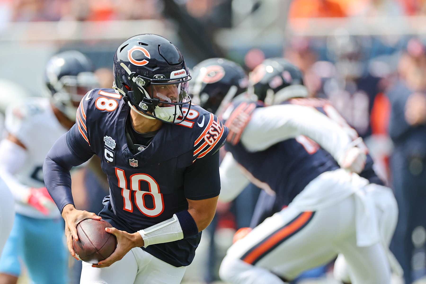 CHICAGO, ILLINOIS - SEPTEMBER 08: Caleb Williams #18 of the Chicago Bears looks to pass during a game against the Tennessee Titans at Soldier Field on September 08, 2024 in Chicago, Illinois. The Bears defeated the Titans 24-17. (Photo by Stacy Revere/Getty Images)