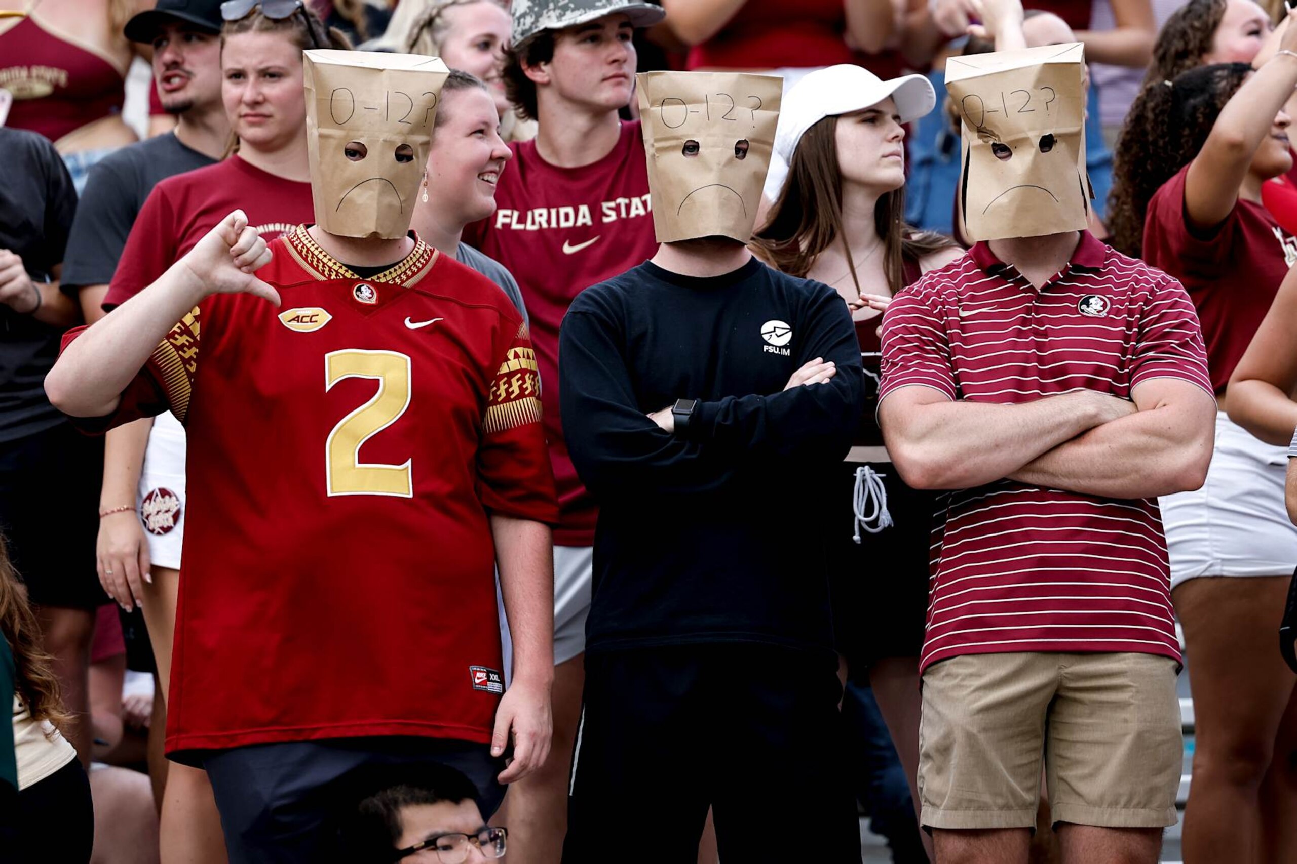 TALLAHASSEE, FL - SEPTEMBER 14: A general view of some Florida State Seminoles Fans with bags over their heads during the game against the Memphis Tigers at Doak Campbell Stadium on Bobby Bowden Field on September 14, 2024 in Tallahassee, Florida. The Tigers defeated the Seminoles 20 to 12. (Photo by Don Juan Moore/Getty Images)