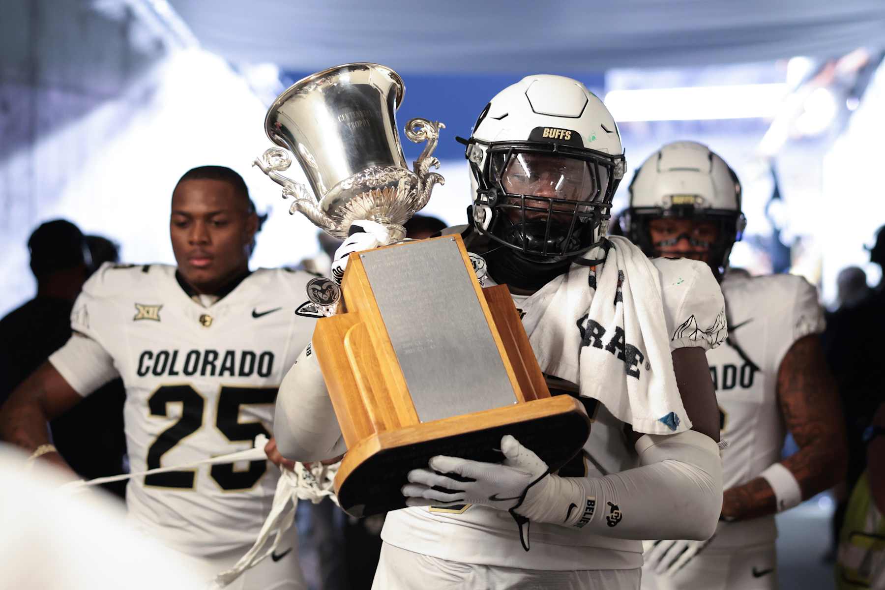FORT COLLINS, COLORADO - SEPTEMBER 14: Tawfiq Thomas #95 of the Colorado Buffaloes carries the Centennial Cup after defeating the Colorado State Rams at Canvas Stadium on September 14, 2024 in Fort Collins, Colorado. (Photo by Andrew Wevers/Getty Images)